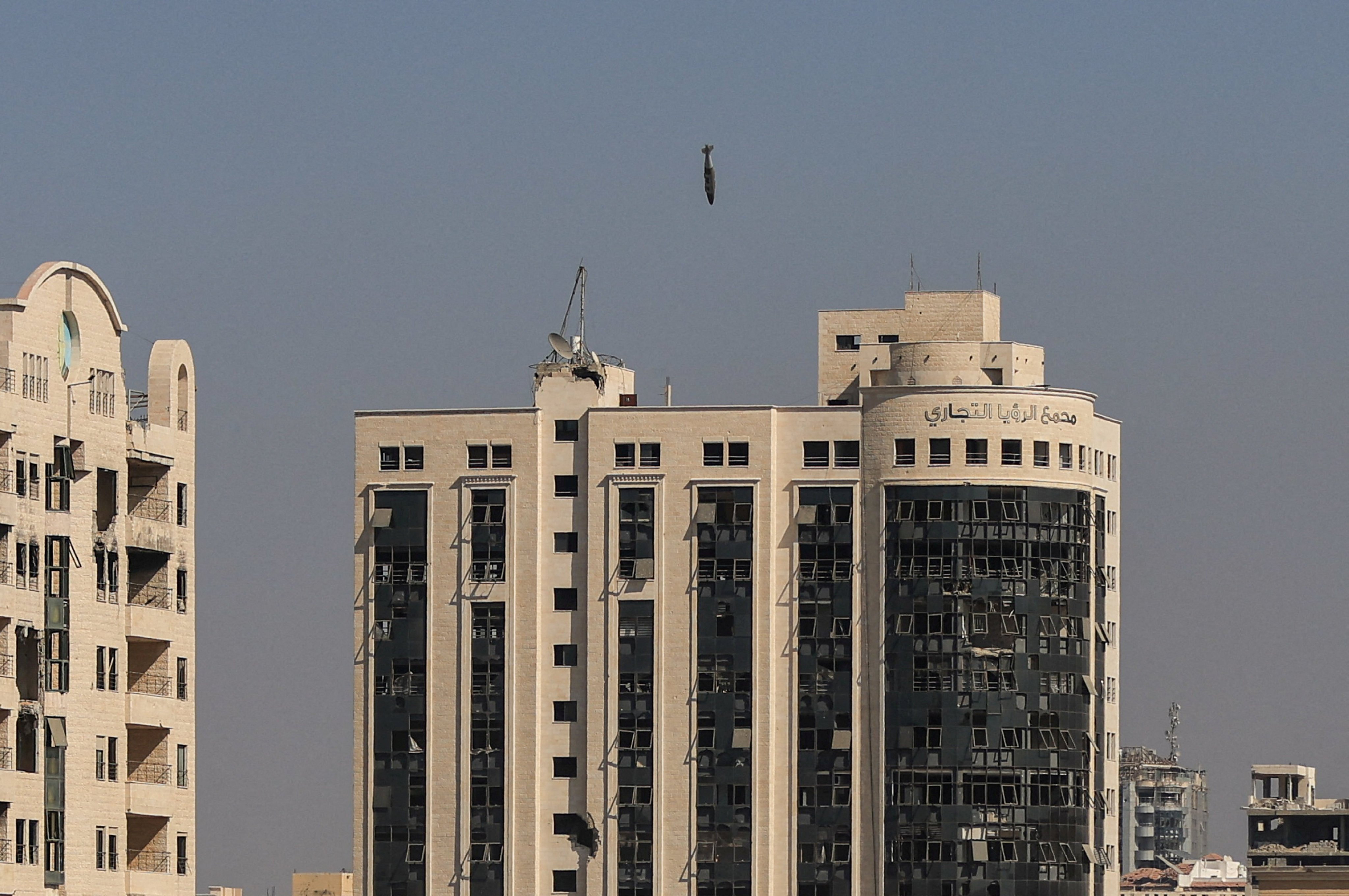 A missile falls towards al-Ruya tower in Gaza City’s Rimal area on Monday. Photo: Reuters