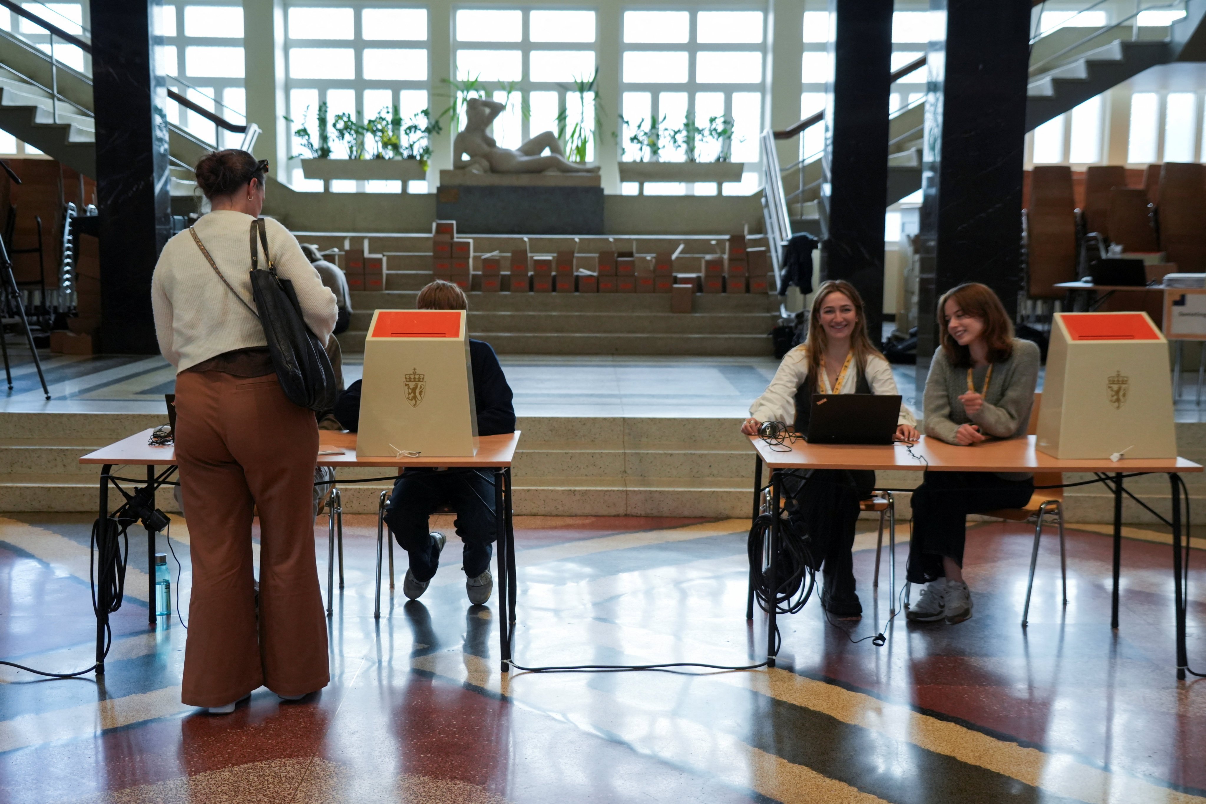 A woman votes in a polling station in Oslo, Norway, on Monday. Photo: Reuters