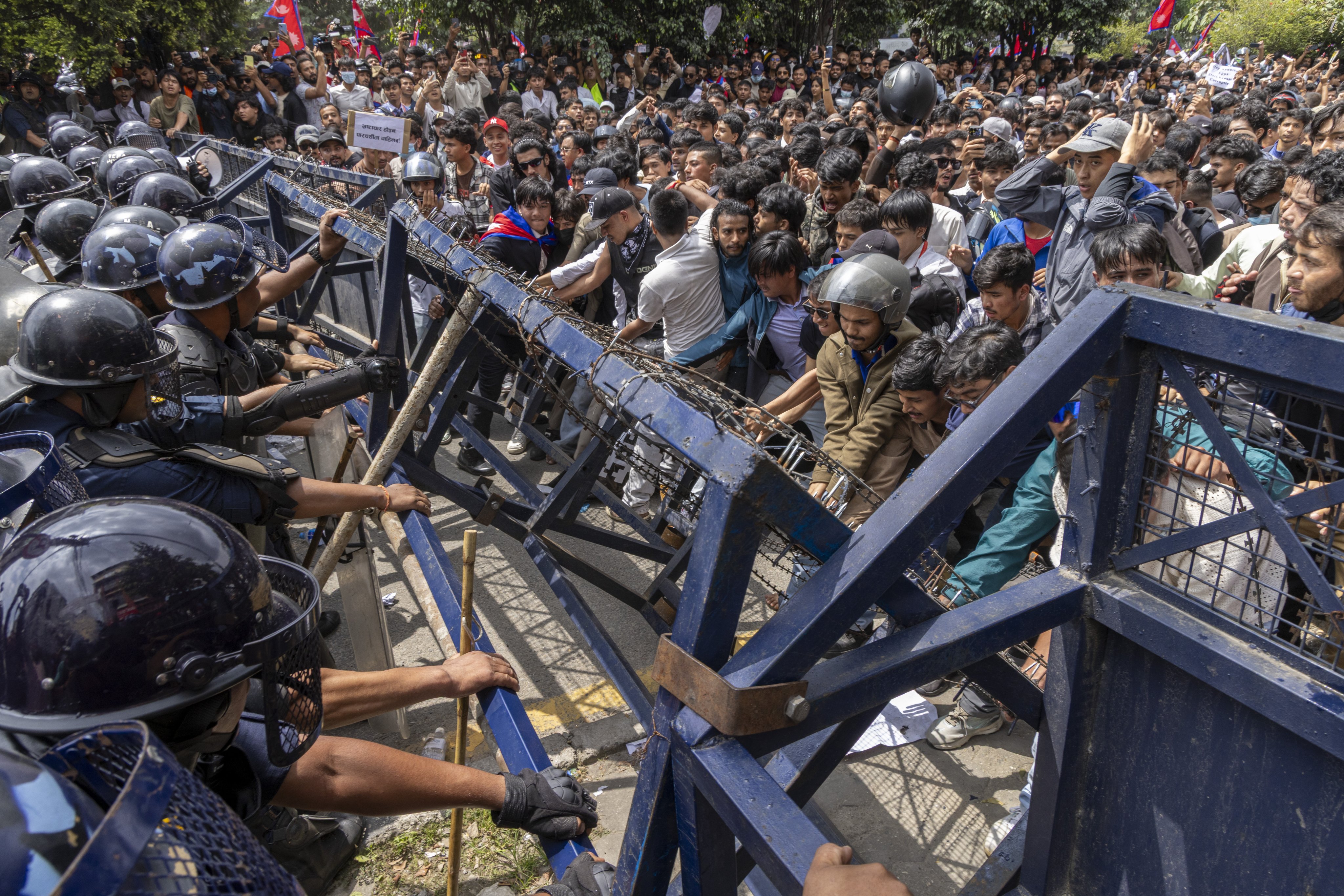 Protesters clash with police in front of the parliament building in Kathmandu, Nepal, on Monday. Photo: EPA