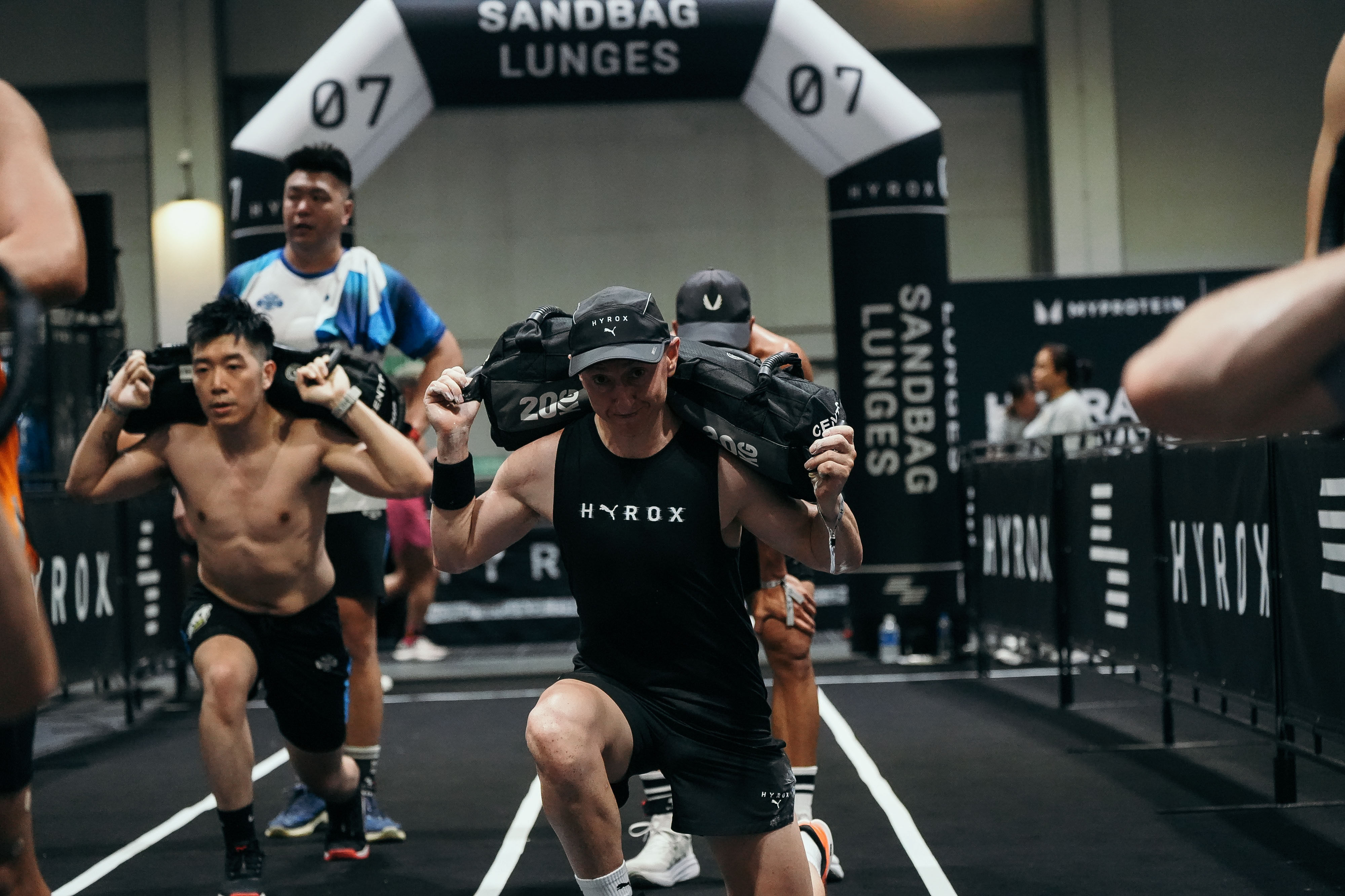 Douglas Bray (centre) competes in the Hyrox challenge in Hong Kong in July 2025. Completing the gruelling race left the cancer survivor feeling “fully recovered” three years after his life-changing surgery. Photo: Douglas Bray