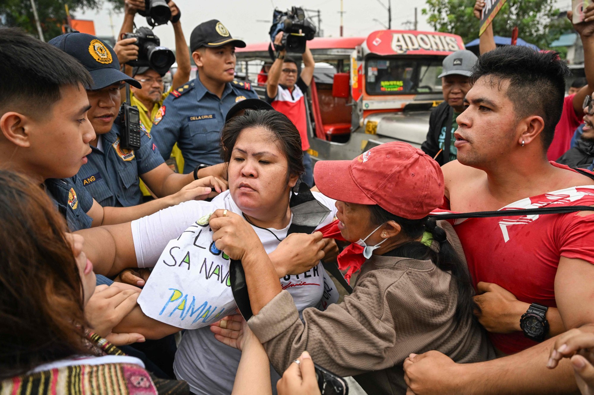 Protesters skirmish with the police as they stage an anti-corruption rally outside the Philippine Department of Public Works and Highways in Navotas, Metro Manila, on Tuesday. Photo: AFP