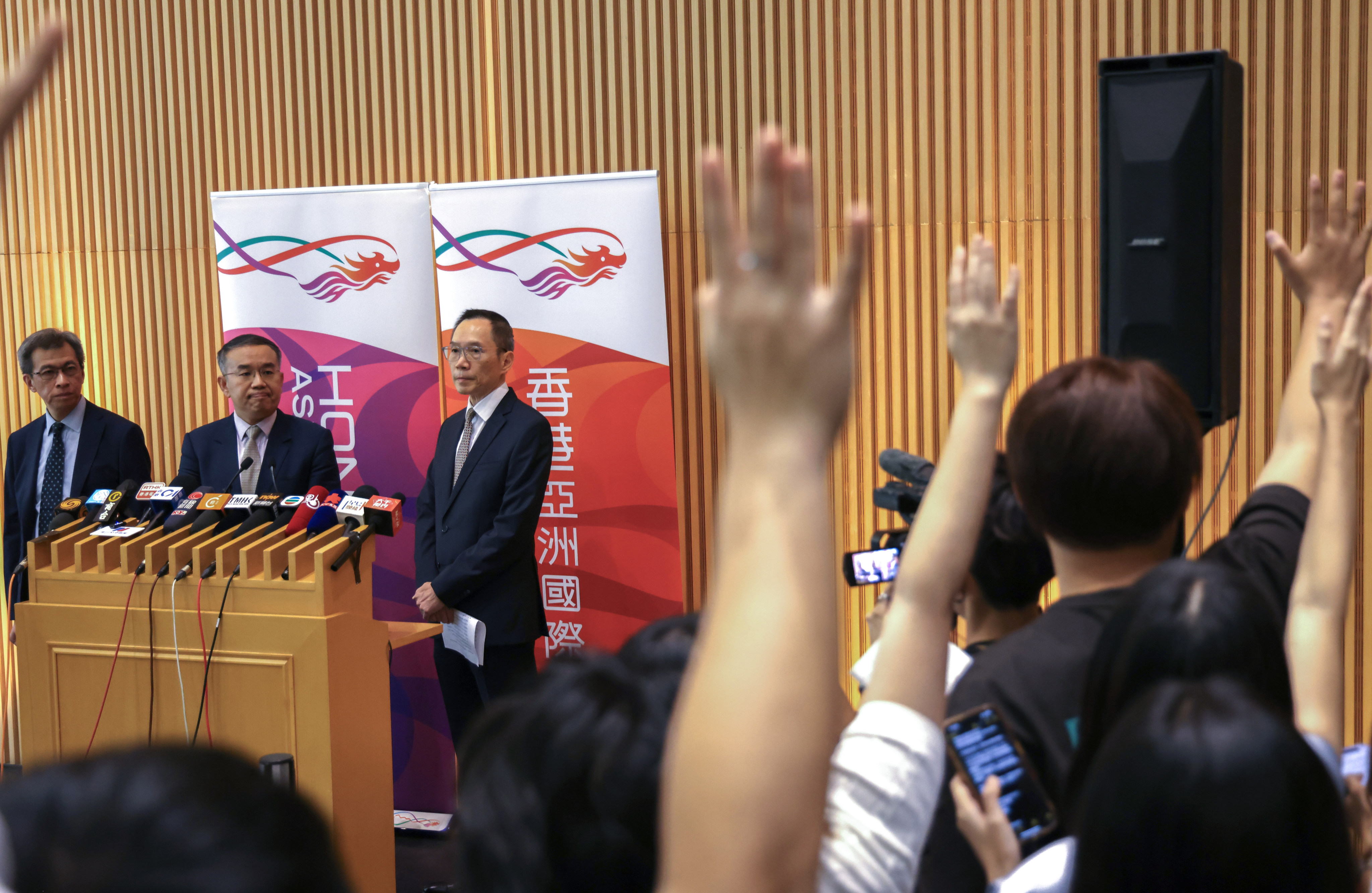 From the left, Permanent Secretary for Financial Services and the Treasury Andrew Lai Chi-wah, Secretary for Financial Services and the Treasury Christopher Hui Ching-yu, and Director of Government Logistics Carlson Chan Ka-shun attend a press briefing on the government procurement regime after the drinking water scandal, at the government headquarters in Hong Kong on August 21. Photo: Karma Lo