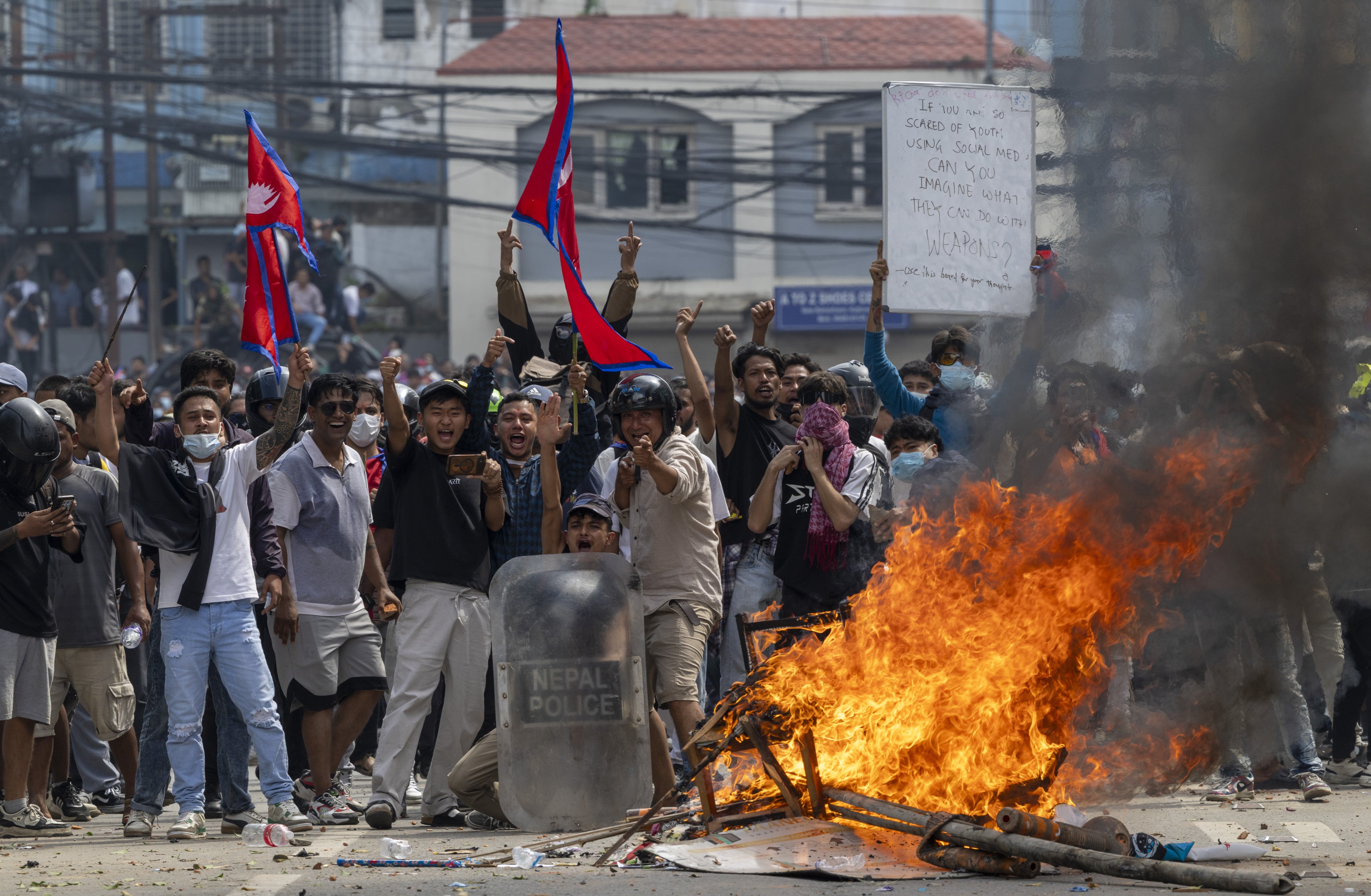 Protesters clash with police in front of the parliament building in Kathmandu on September 8. Photo: EPA