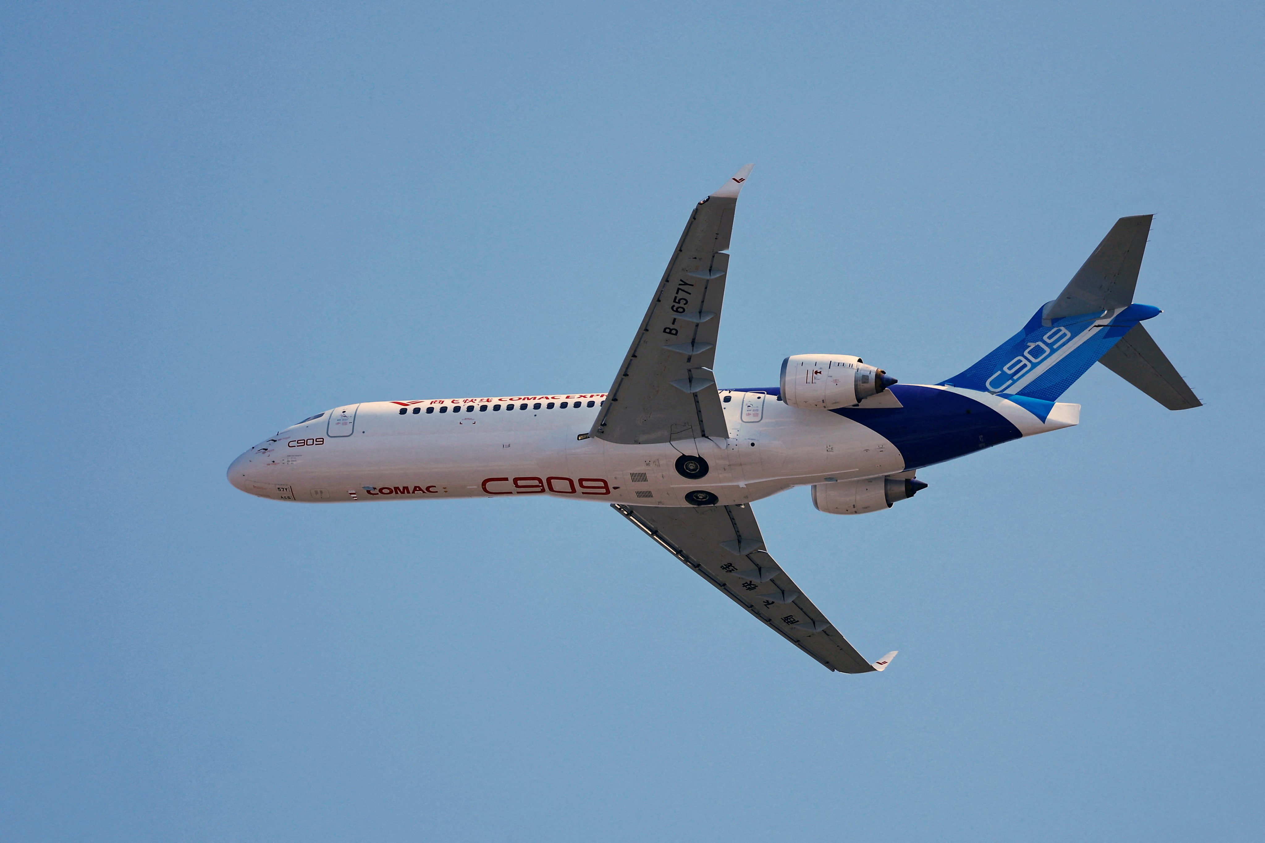 A Comac C909 regional jet flies in the sky at the China International Aviation and Aerospace Exhibition, or Airshow China, in Zhuhai, Guangdong province, on November 12, 2024. Photo: Reuters