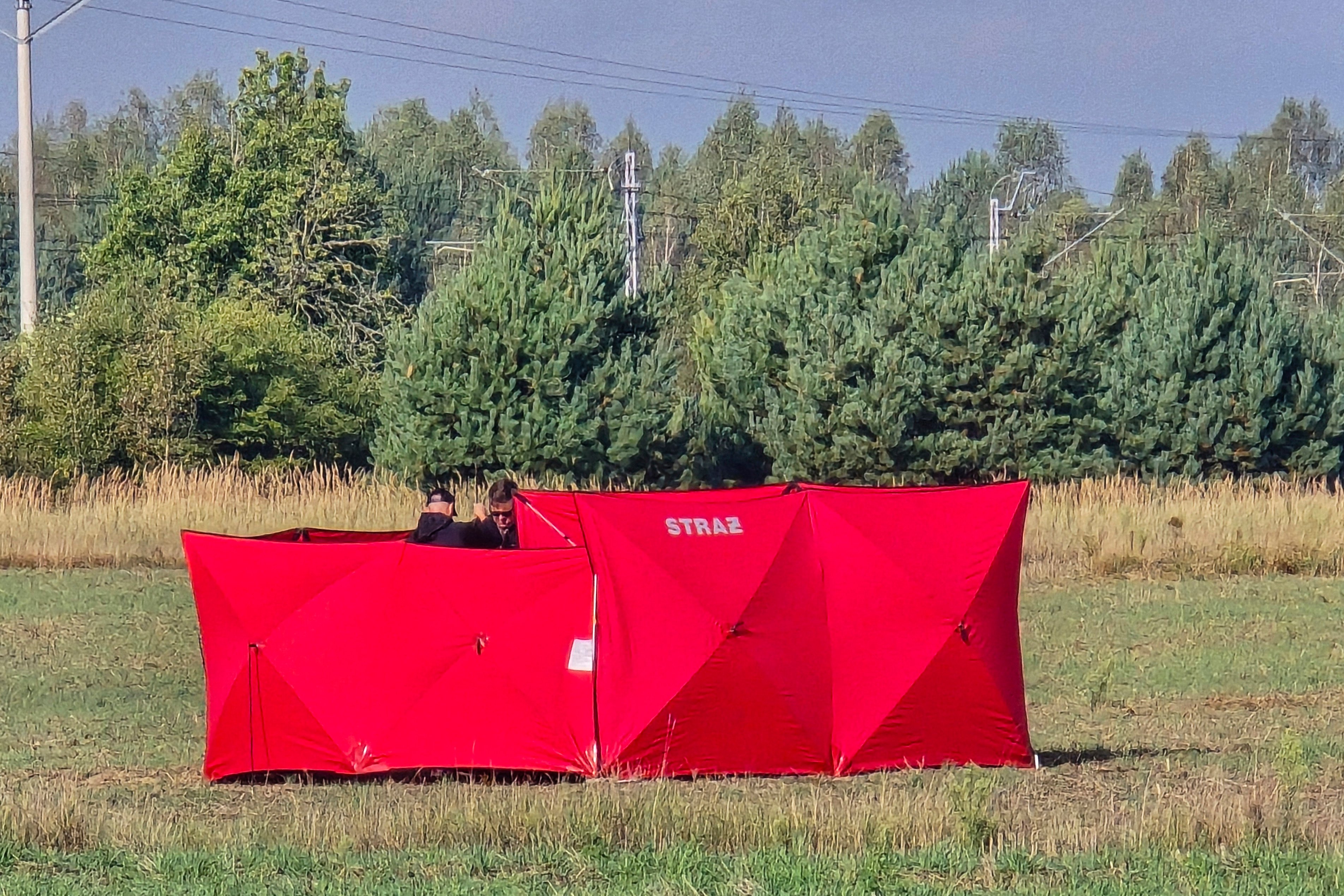 Responders secure parts of a UAV shot down near Biala Podlaska, Poland. Photo: AP