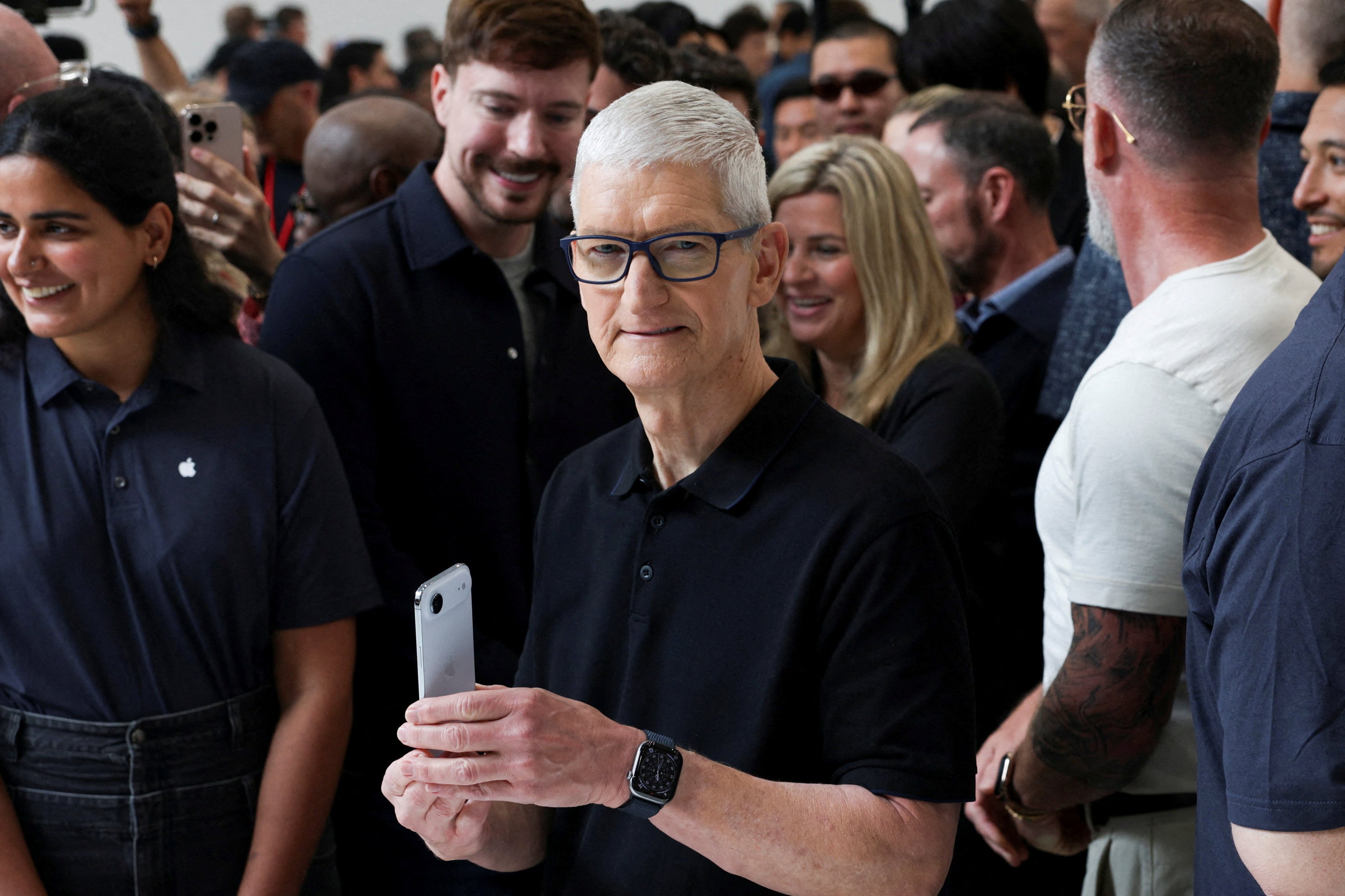 Apple CEO Tim Cook holds an iPhone Air, as Apple holds an event at the Steve Jobs Theater in Cupertino, California, on Tuesday. Photo: Reuters