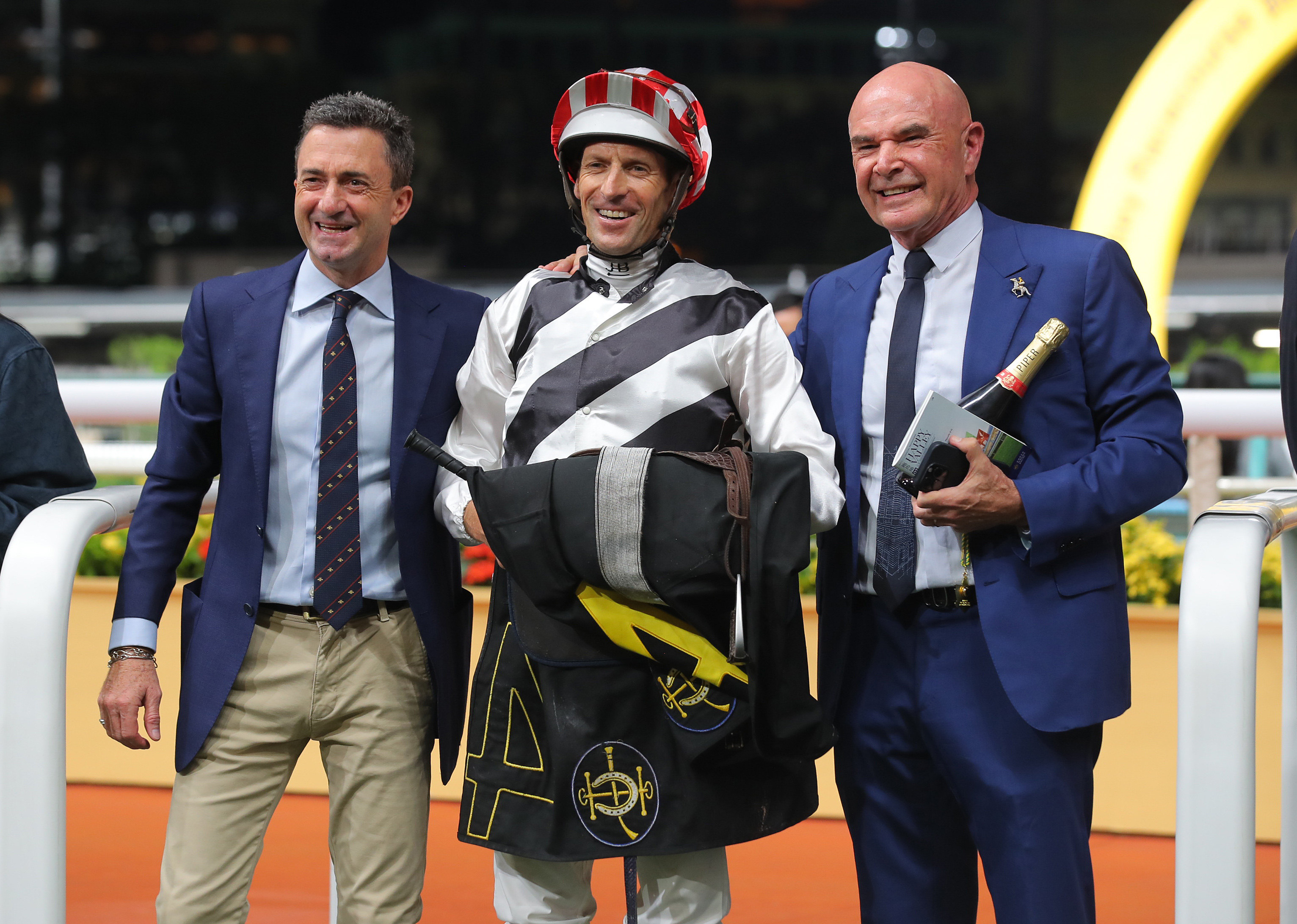 Trainer Douglas Whyte, jockey Hugh Bowman and owner David Boehm celebrate Dan Attack’s Happy Valley win. Photos: Kenneth Chan
