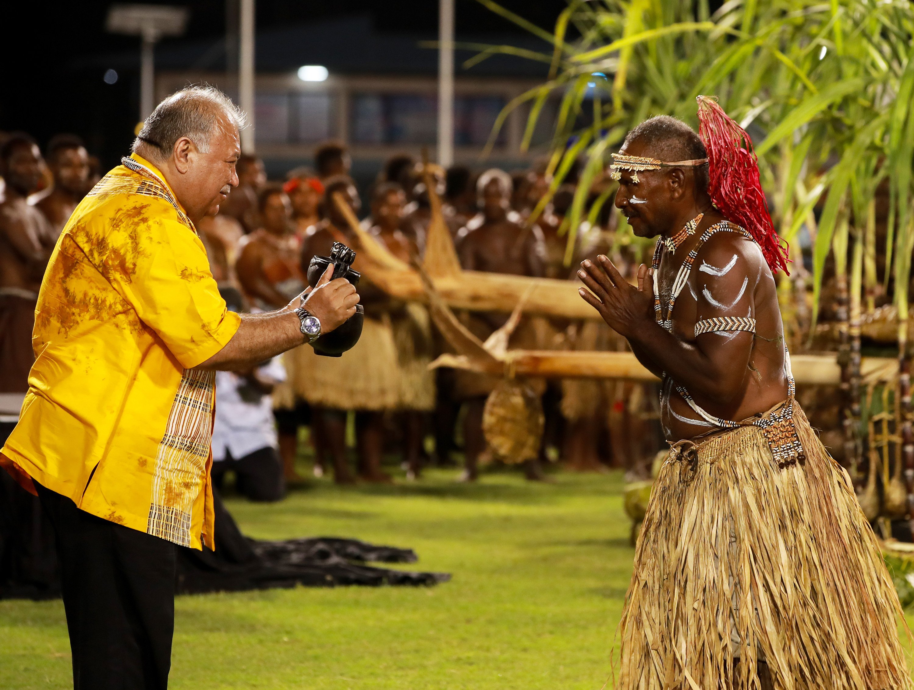 Pacific Islands Forum Secretary-General Baron Waqa receives a gift from a Solomon Islander during the opening ceremony on Monday. Photo: Xinhua