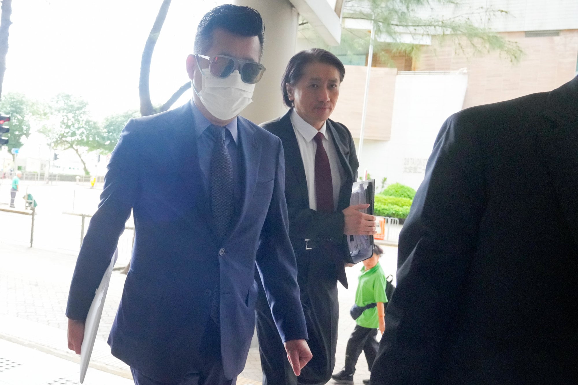 Johnson Chan, left, at Eastern Court to face accusations of threatening and assaulting his wife. Photo: May Tse