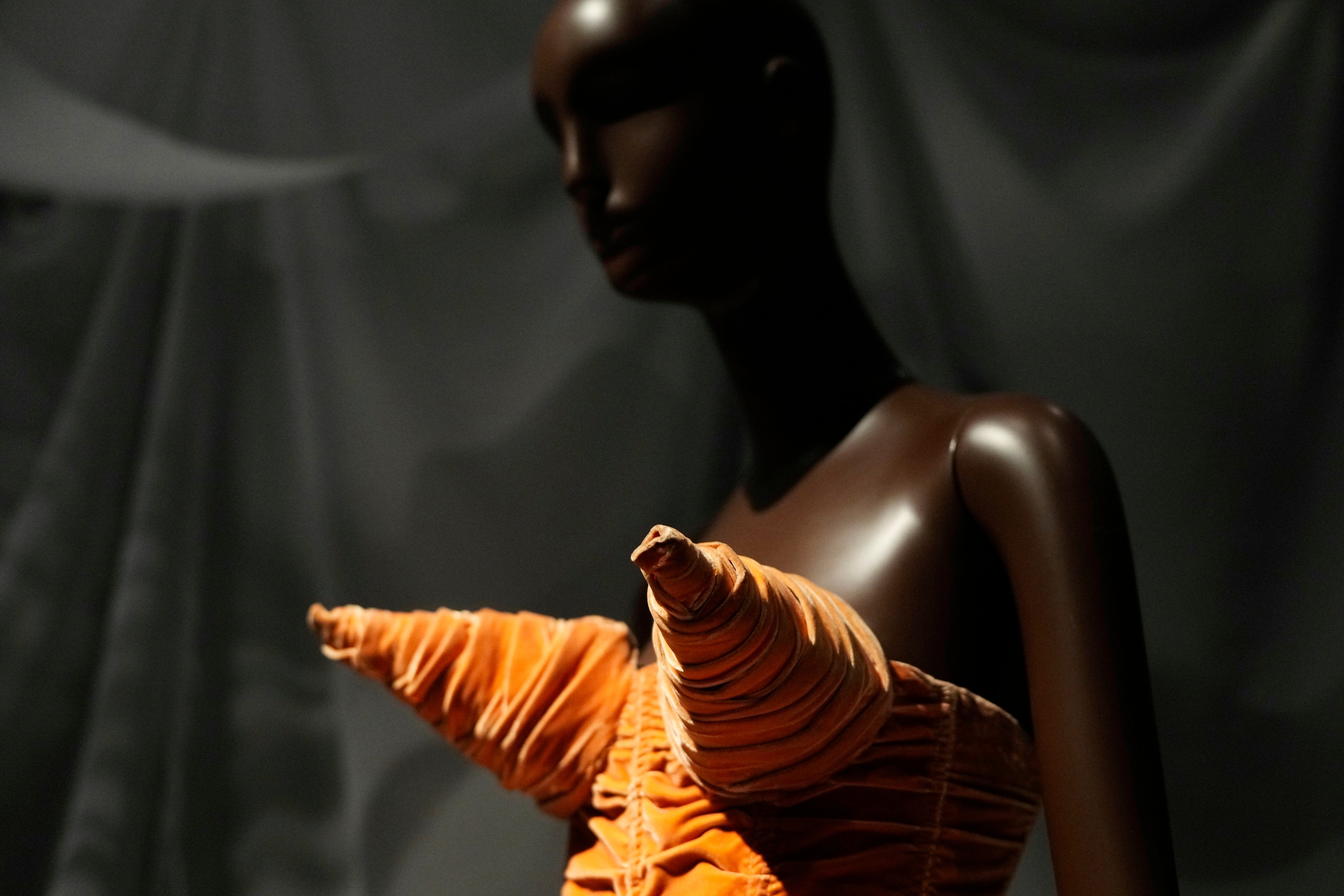 A cone-bra dress designed by Jean Paul Gaultier is displayed during a press preview for the exhibit “Dress, Dreams and Desire: Fashion and Psychoanalysis” on Tuesday, Sept. 9, 2025, at The Museum at FIT in New York. (Photo by Charles Sykes/Invision/AP)