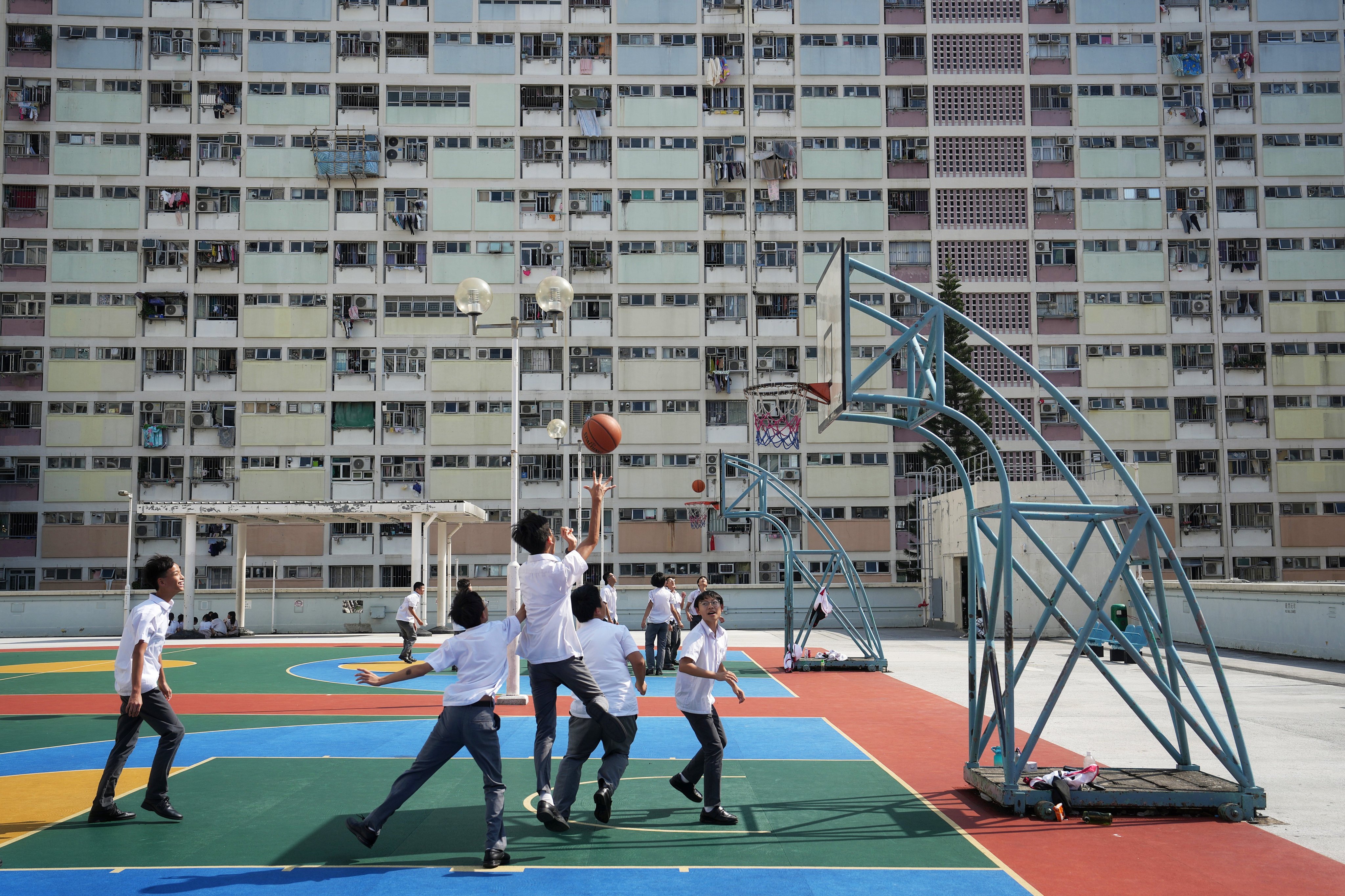 Children playing basketball at Choi Hung Estate, Hong Kong. Photo: Elson Li