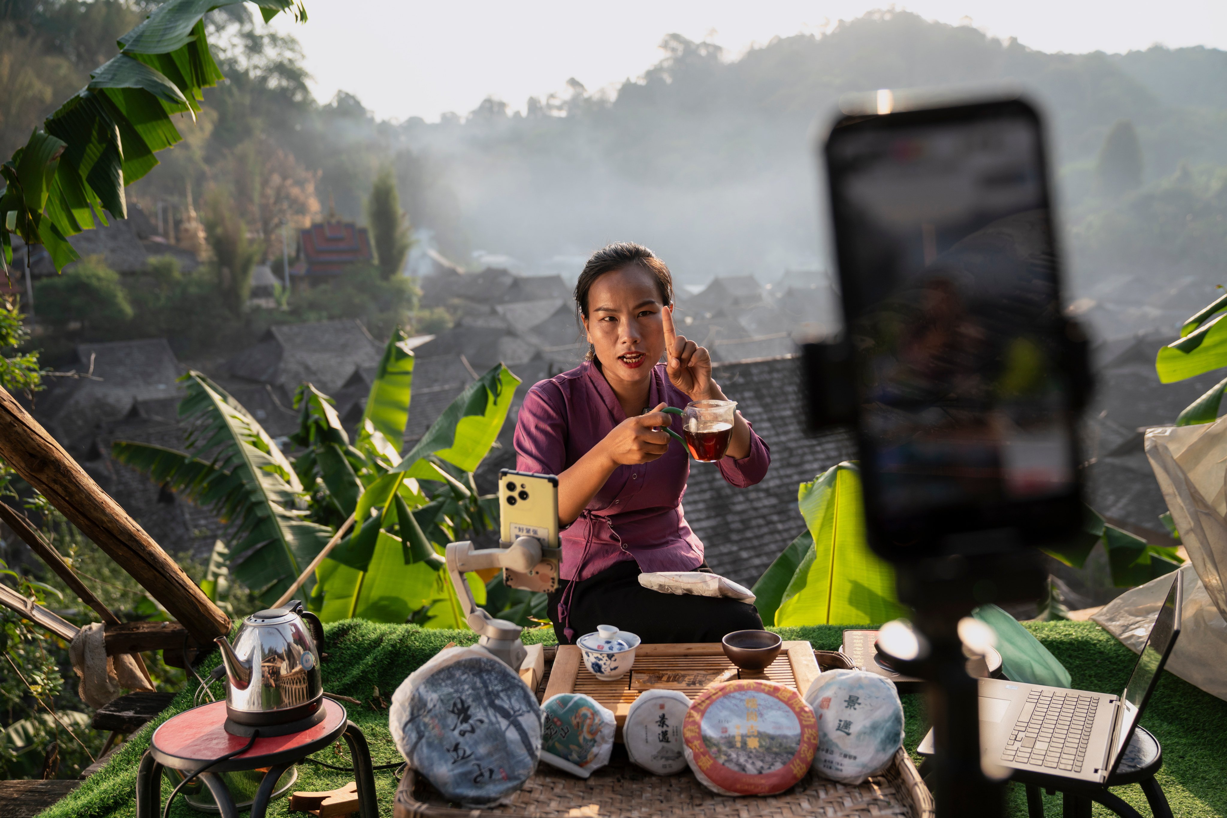 Tea grower Ai Yong from the Dai indigenous community hosts a live stream, describing the taste and aroma of her Puer to enthusiasts across China. As Jingmai Mountain’s tea continues to fetch high prices, some residents of the remote area in southwestern China’s Yunnan province have found new ways to connect with consumers. Photo: Justin Jin