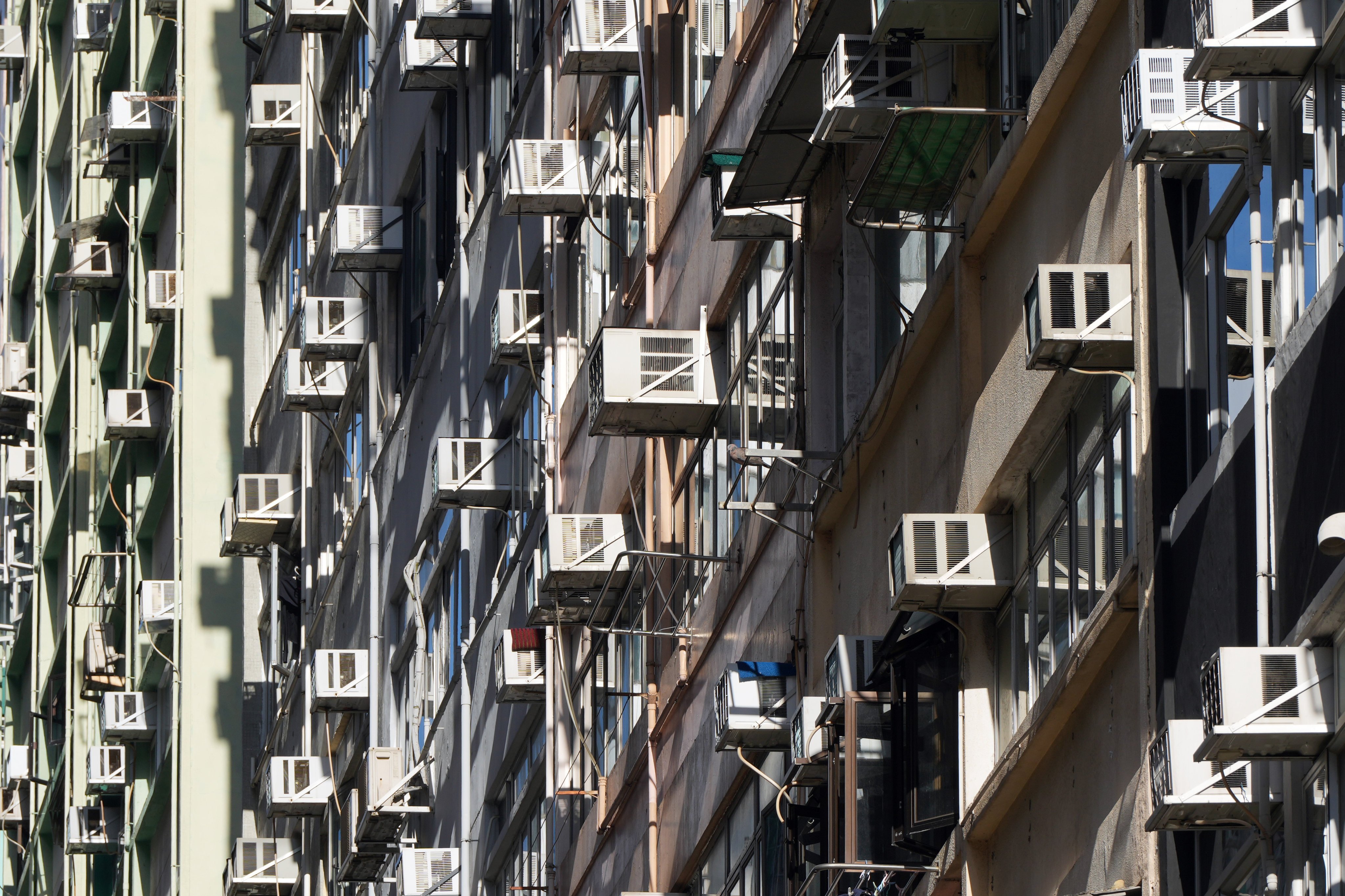 Air conditioners are seen on the side of a residential building in Wan Chai on August 27. Photo: Sam Tsang