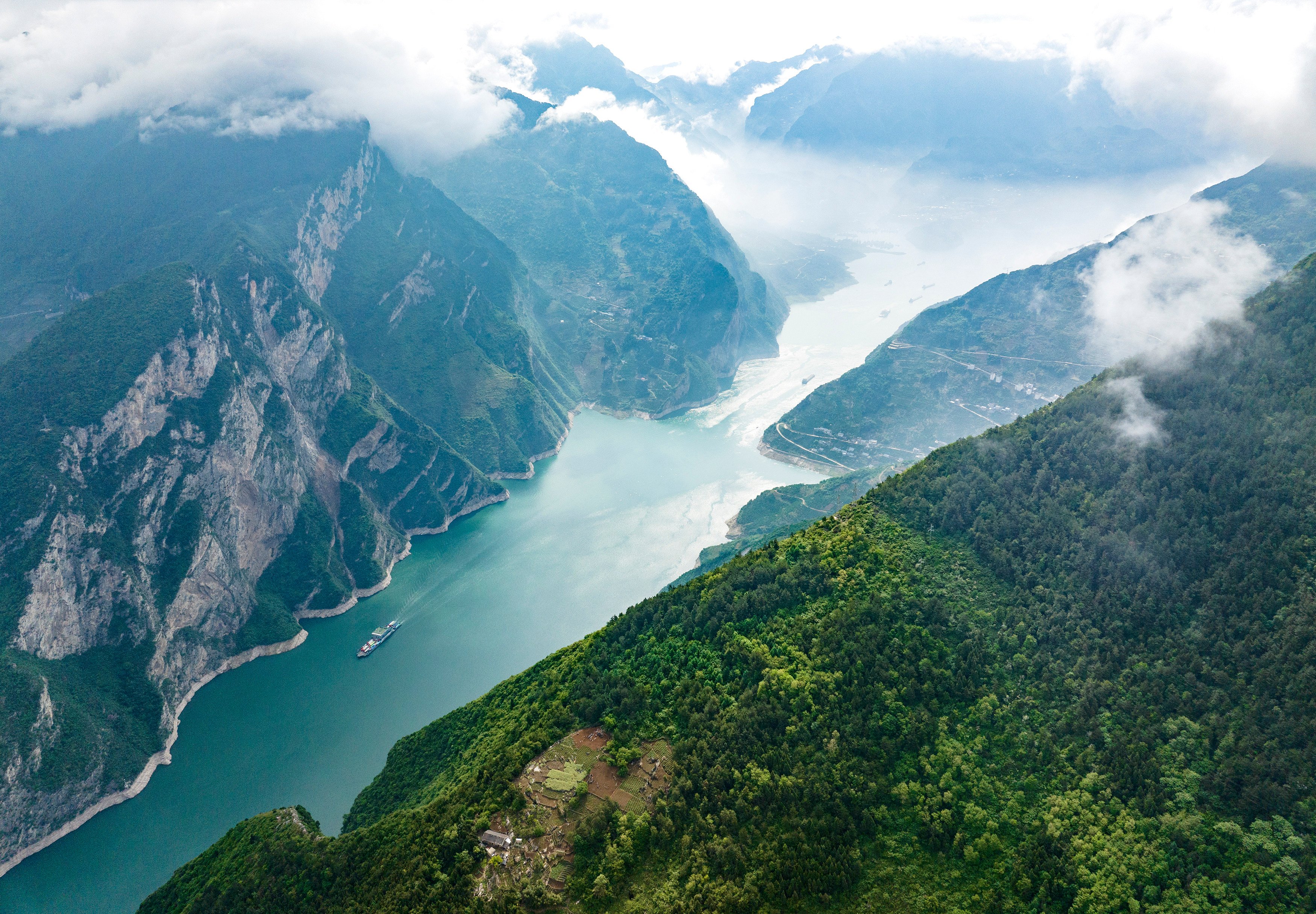 Ships sail in the Xiling Gorge of the Three Gorges of the Yangtze River in Yichang city, Hubei province, China, on May 5, 2024. Photo: Future Publishing via Getty Images