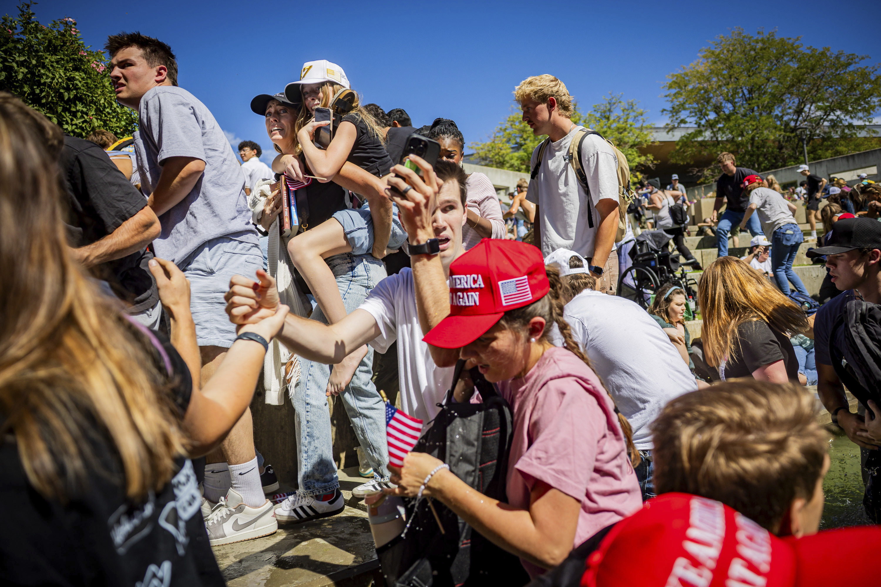 A crowd scatters after Charlie Kirk was shot. Photo: Tess Crowley/The Deseret News via AP