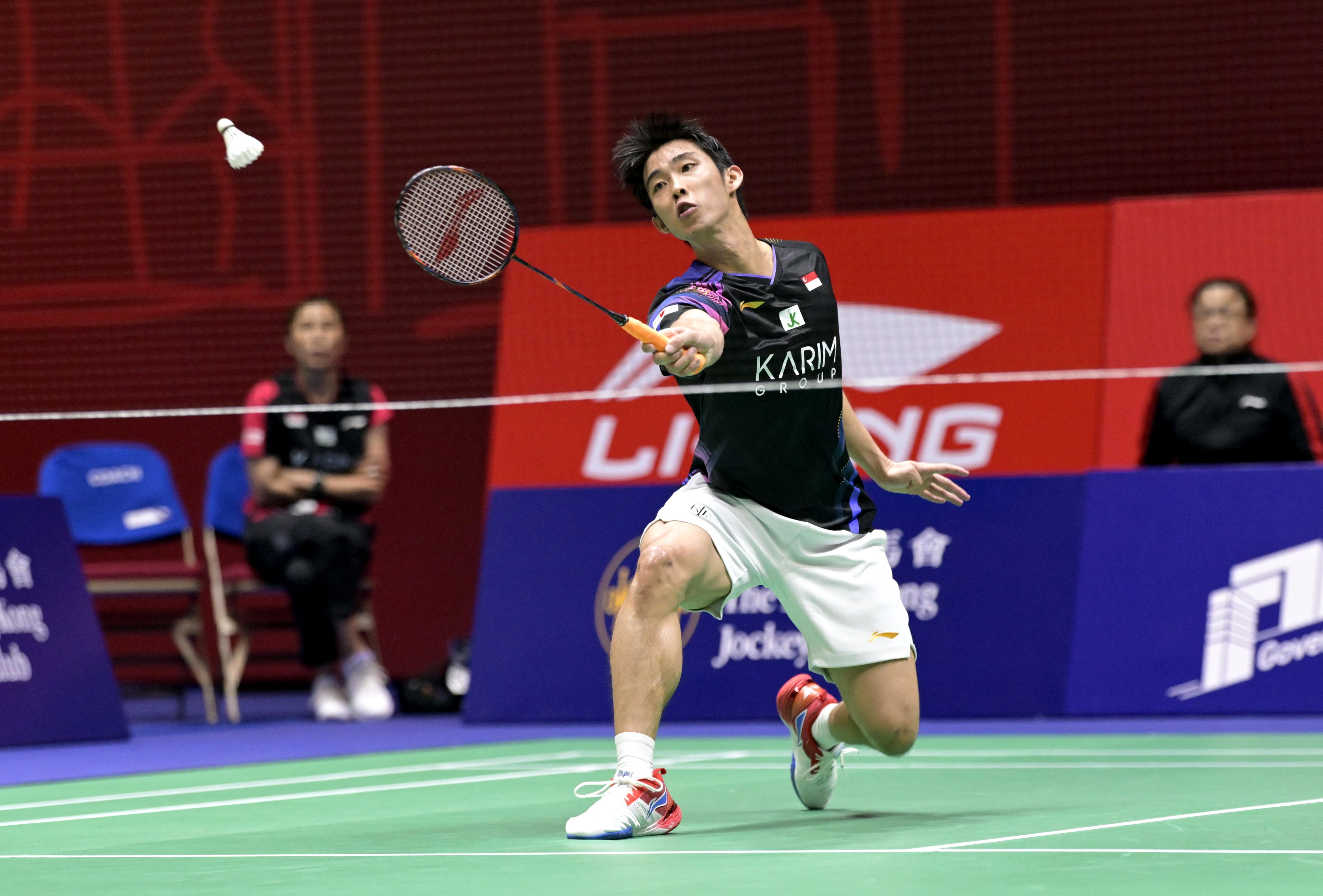 Loh Kean Yew of Singapore hits a return during his second-round  Hong Kong Open match against Denmark’s Rasmus Gemke on Thursday. Photo: Xinhua