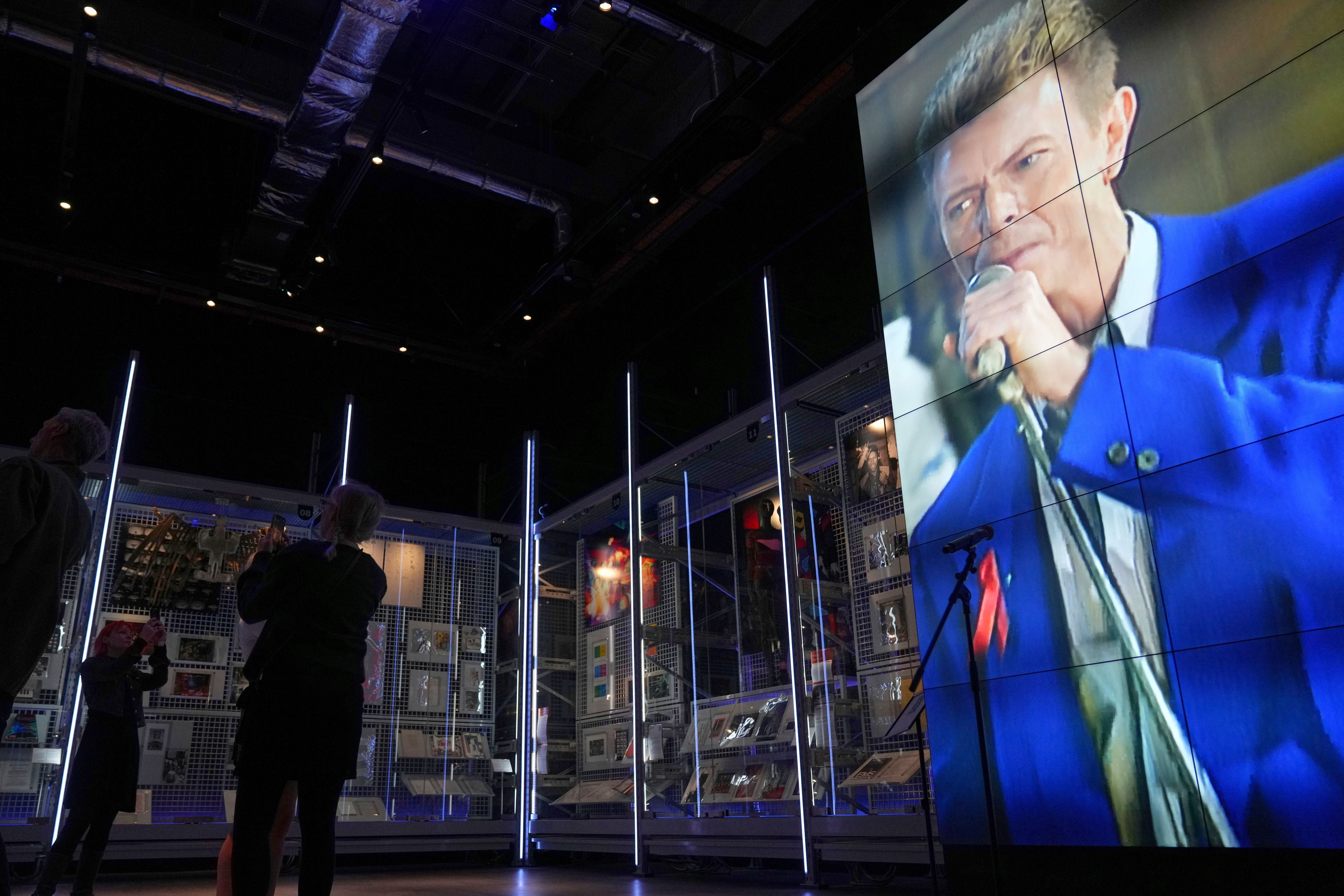 Visitors take photos at the David Bowie Centre, a new archive at the V&A East Storehouse in London on September 10, 2025, ahead of its public opening on Saturday. Photo: AP