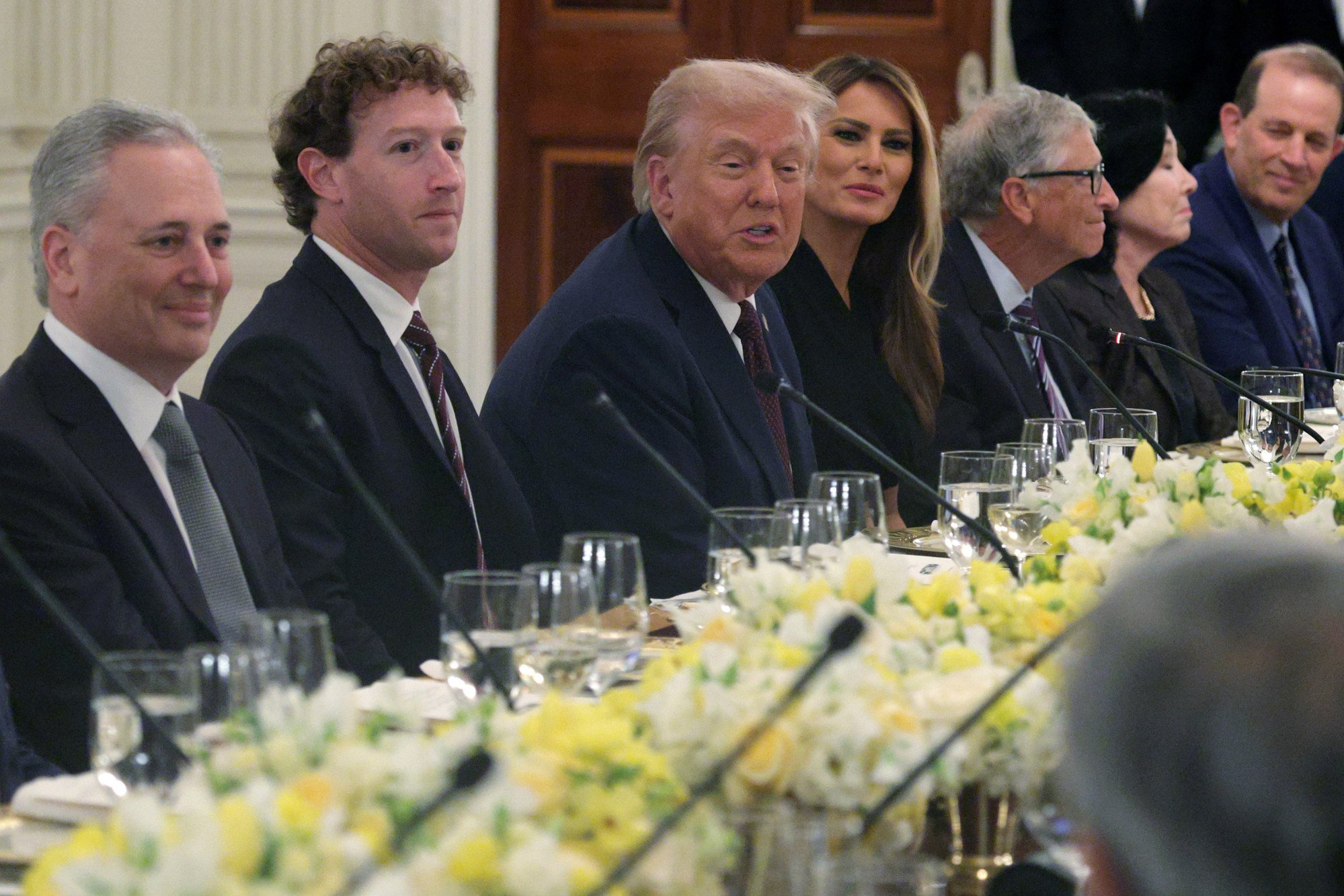 US President Donald Trump speaks as, from left, White House “AI and Crypto Czar” David Scahs, Meta CEO Mark Zuckerberg, and first lady Melania Trump listen during a White House dinner on September 4. Photo: Getty Images/Tribune News Service