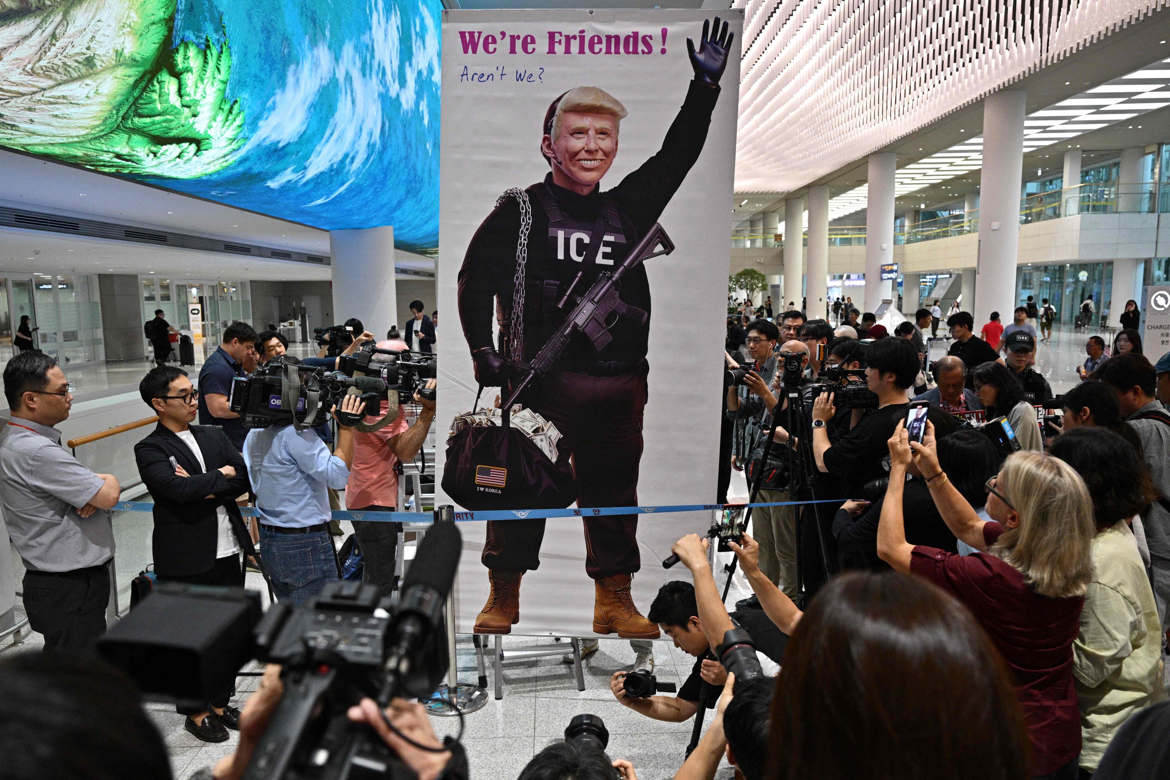 A banner depicting US President Donald Trump is displayed at Incheon airport on Friday. Photo: AFP