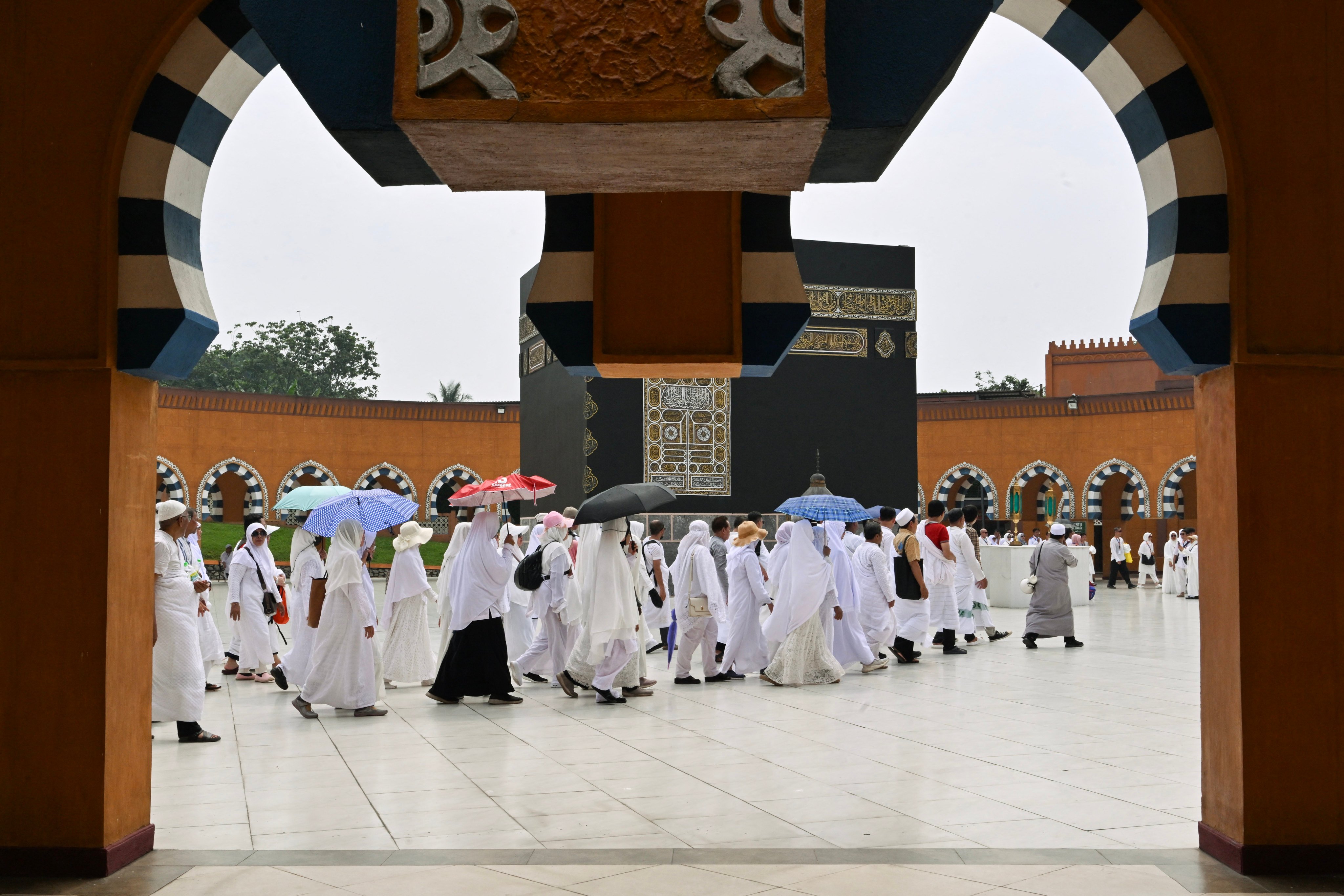 Muslims circumambulate around a replica of the Kaaba, Islam’s holiest shrine, at a training centre in Indonesia where pilgrims train to perform Haj rituals. Photo: AFP