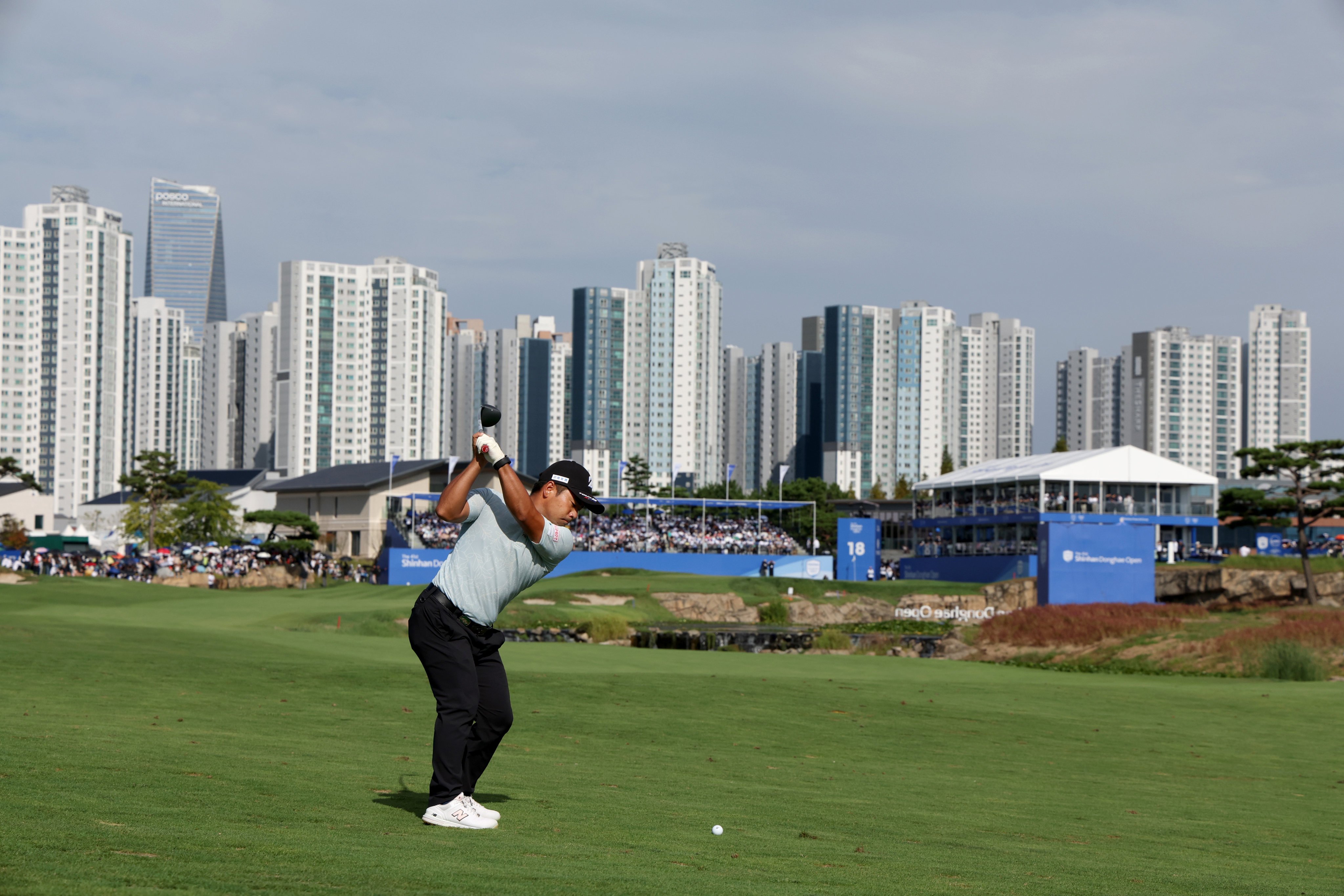 Kazuki Higa hits his approach into the 18th green during the final round at the Jack Nicklaus Golf Club. Photo: Korean PGA Tour