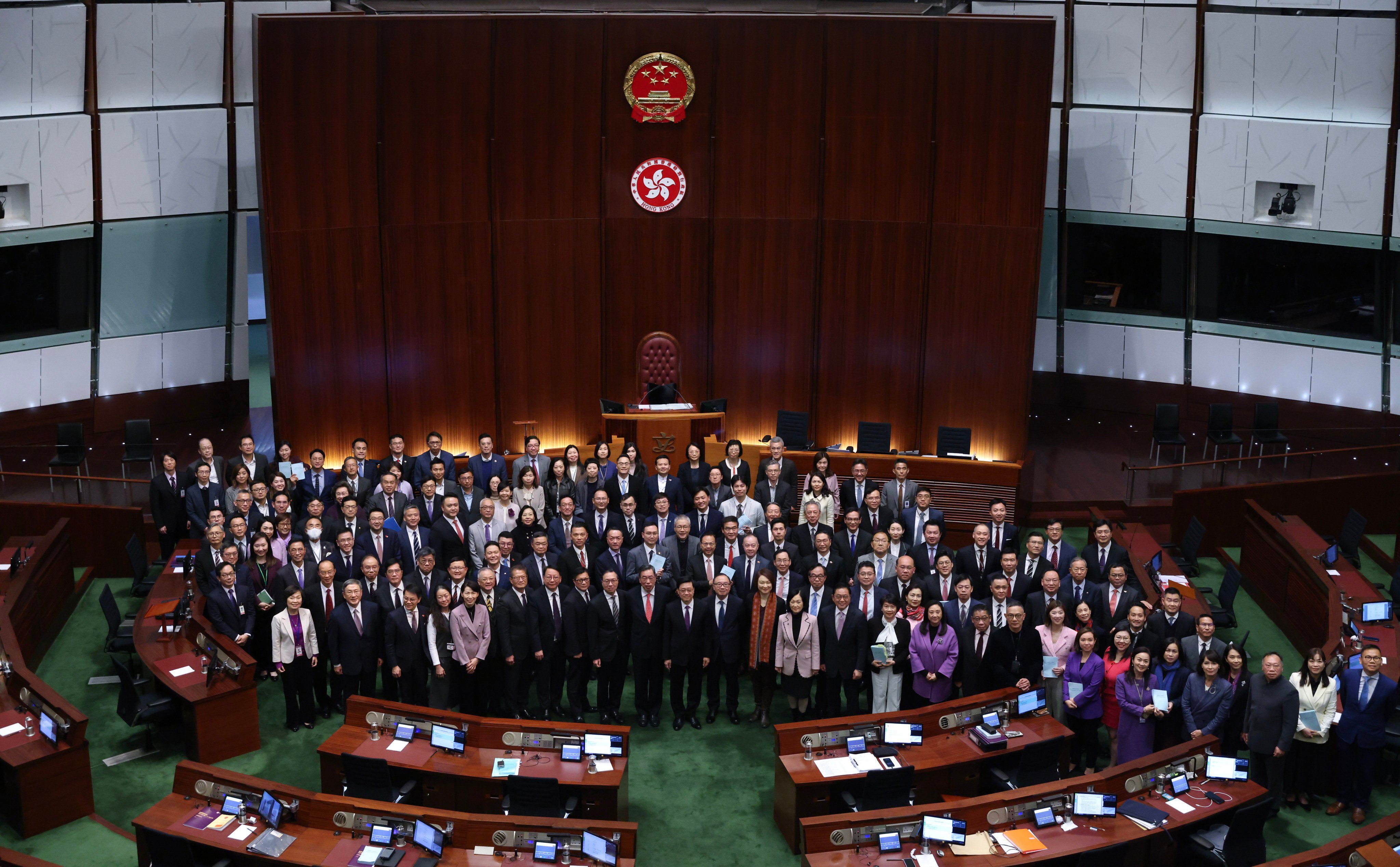 Chief Executive John Lee (green tie) and lawmakers in the chamber of the Legislative Council in March 2024 after successfully enacting the Article 23 national security law. Photo: Yik Yeung-man