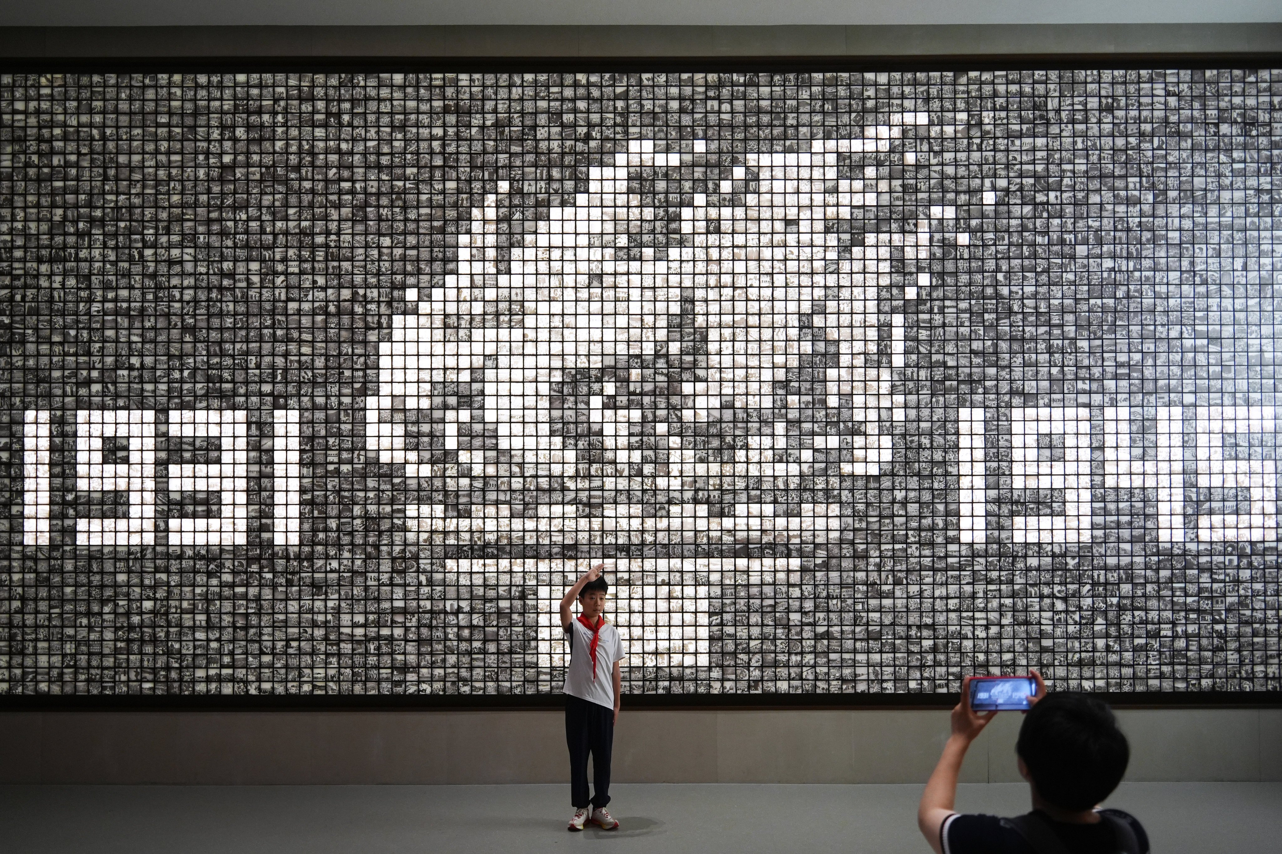 A boy salutes at the Museum of the War of Chinese People’s Resistance against Japanese Aggression in Beijing on Sunday. Photo: Eugene Lee