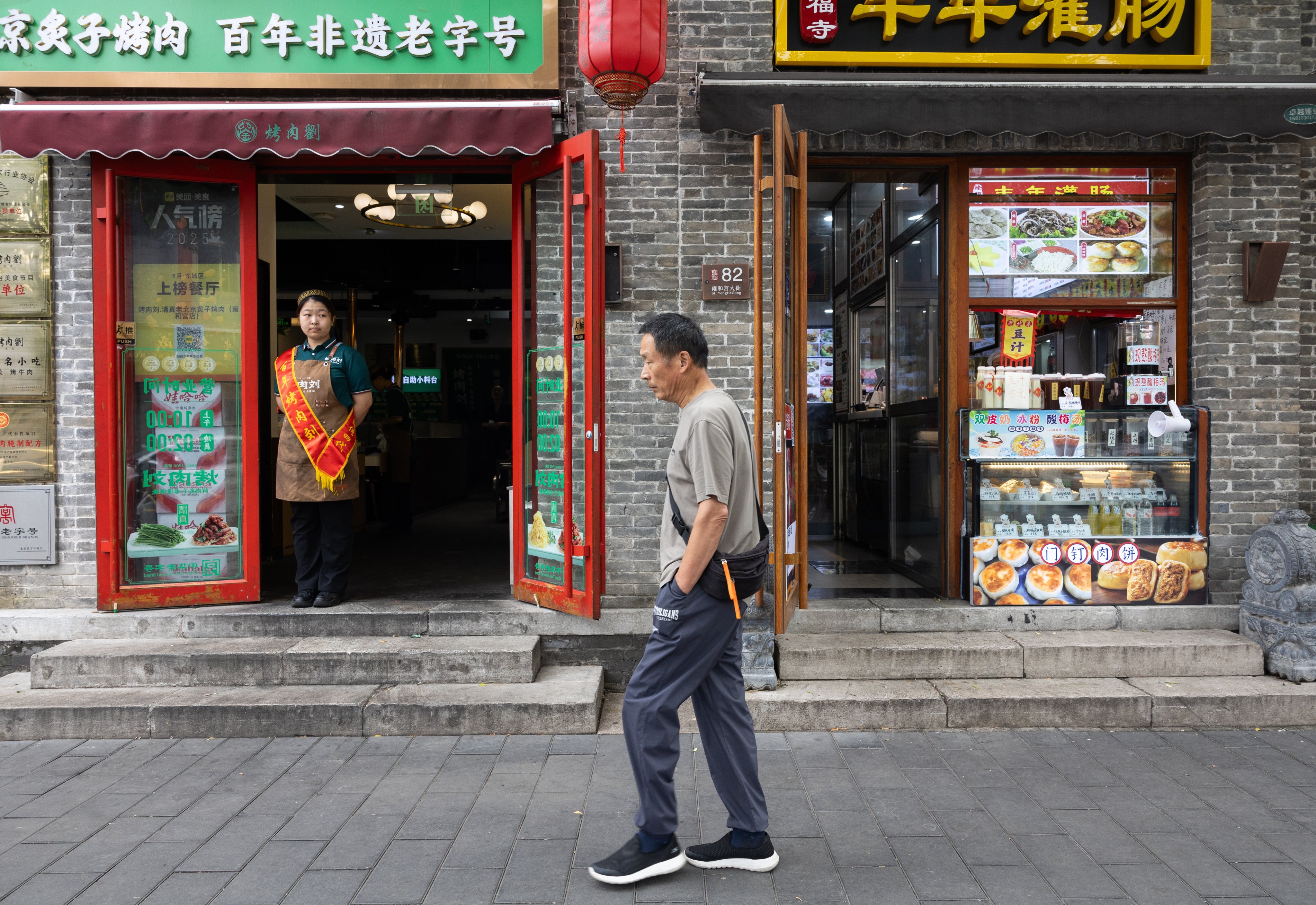 A person walks at a market in Beijing on September 10. Photo: EPA