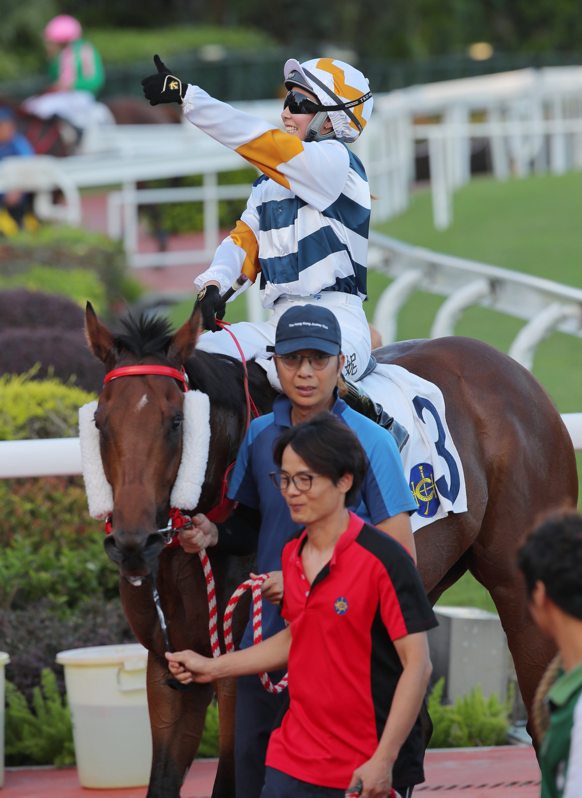 Jockey Britney Wong gives a thumbs up after saluting aboard Packing Bole. Jockey Britney Wong gives a thumbs up after saluting aboard Packing Bole.