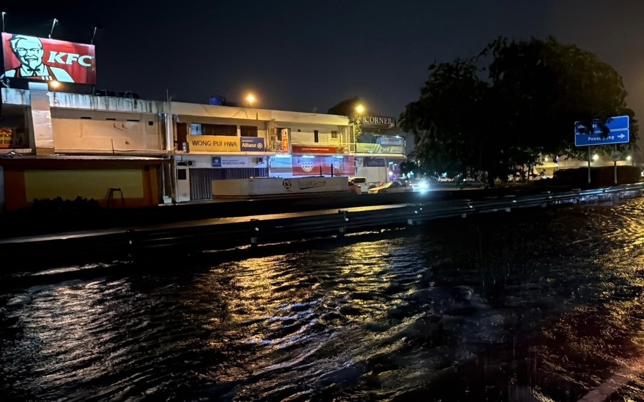 A flooded road in Kota Kinabalu after days of nonstop rain triggered by flash floods hit areas in and around Sabah’s capital over the past week. Photo: Facebook/GregoryTan