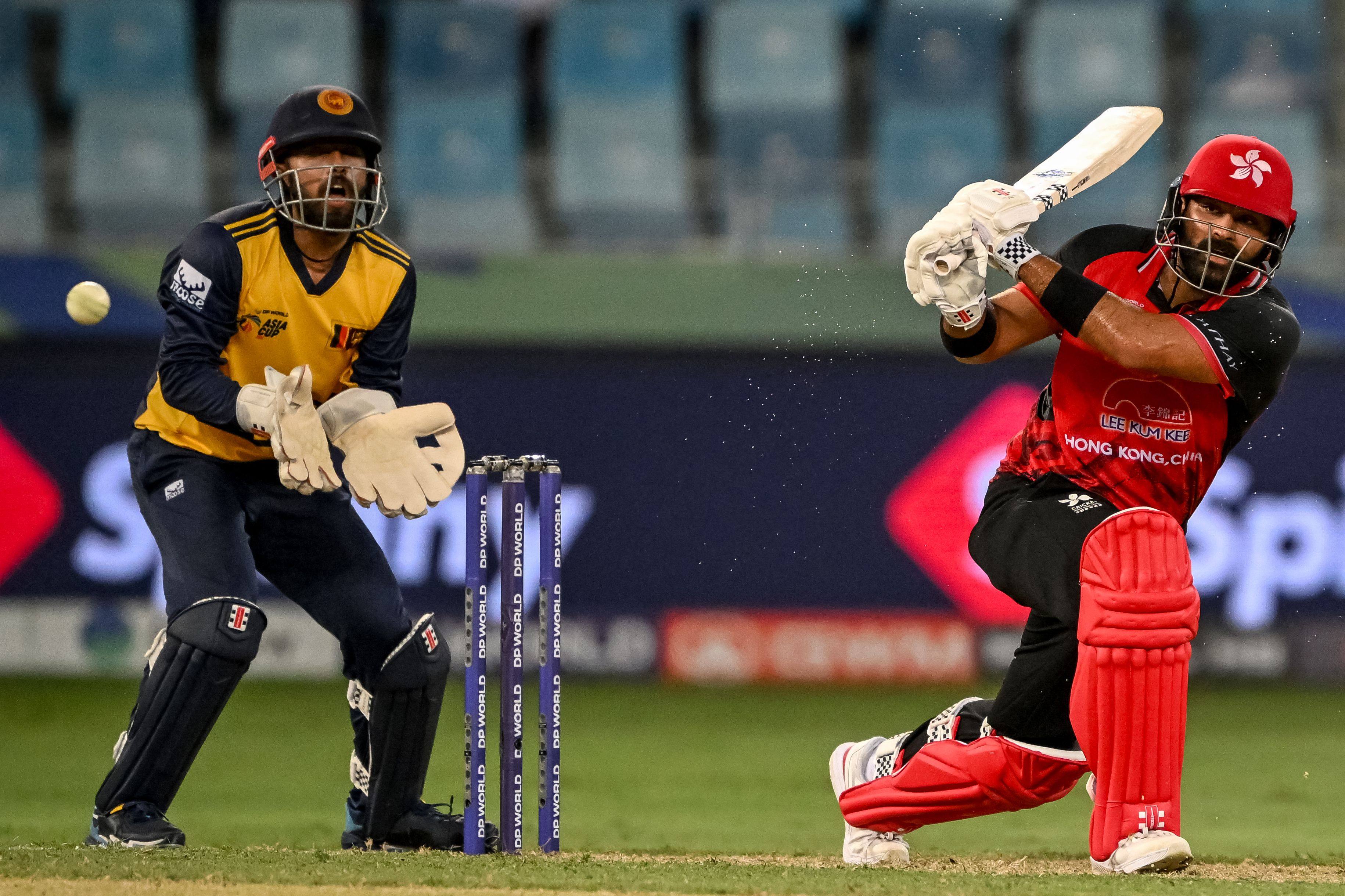 Hong Kong batsman Anshuman Rath pulls to the legside as Sri Lanka wicketkeeper Kusal Mendis watches on. Photo: AFP
