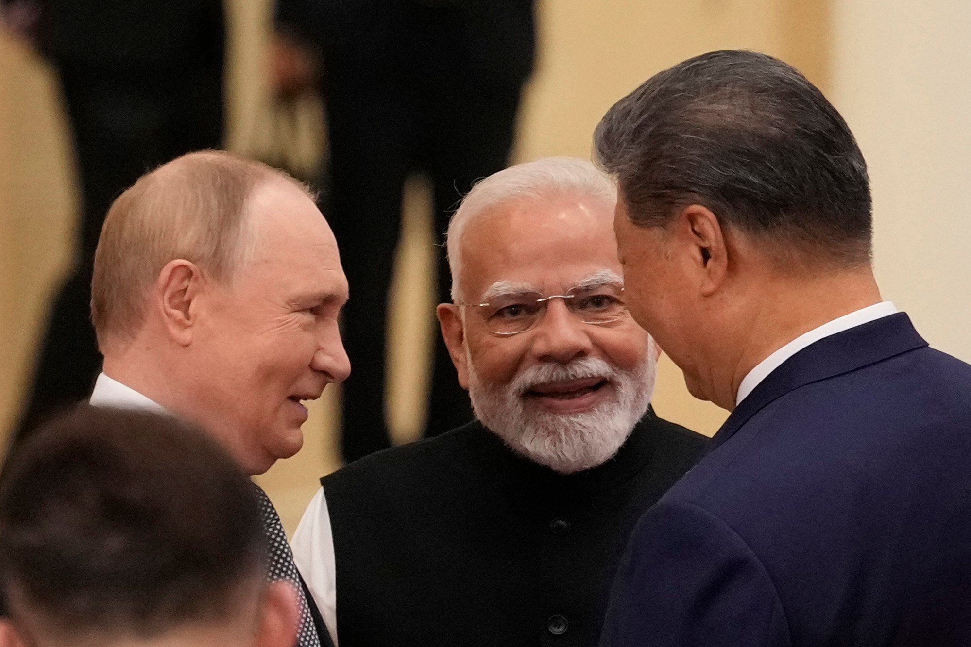 Indian Prime Minister Narendra Modi (centre) talks to Russian President Vladimir Putin (left) and Chinese President Xi Jinping ahead of the Shanghai Cooperation Organisation summit at the Meijiang Convention and Exhibition Centre in Tianjin on September 1. Photo:TNS