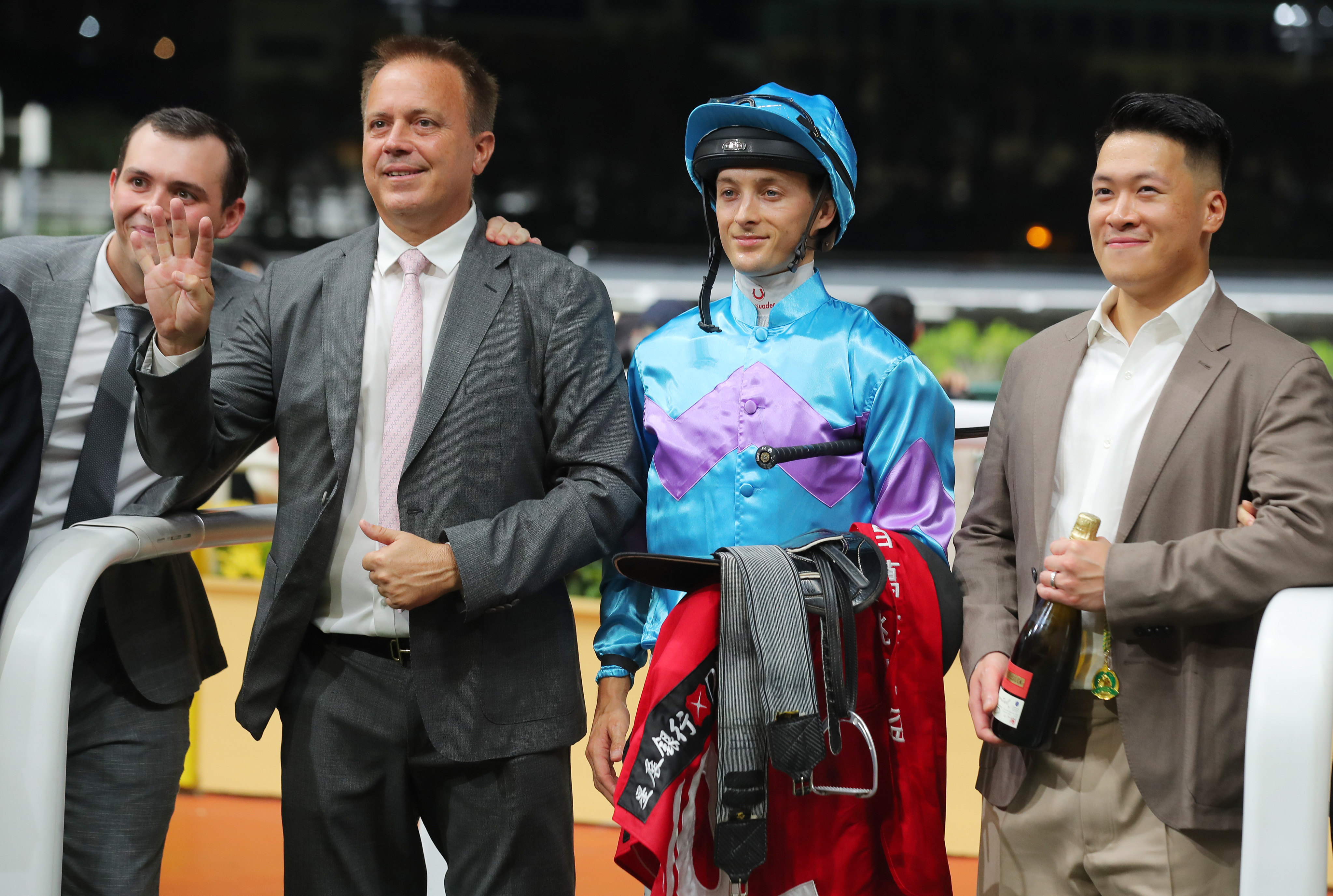 Trainer Caspar Fownes (second from left) celebrates his Happy Valley four-timer with son Ronan (left), jockey Harry Bentley and connections of Lo Rider. Photos: Kenneth Chan