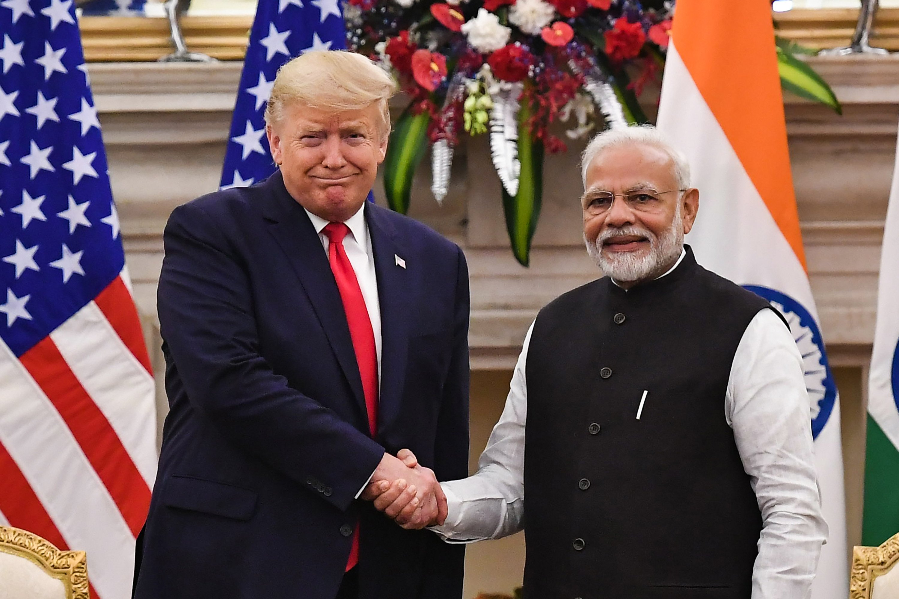 India’s Prime Minister Narendra Modi shakes hands with US President Donald Trump before a meeting in New Delhi in February 2020. Photo: TNS
