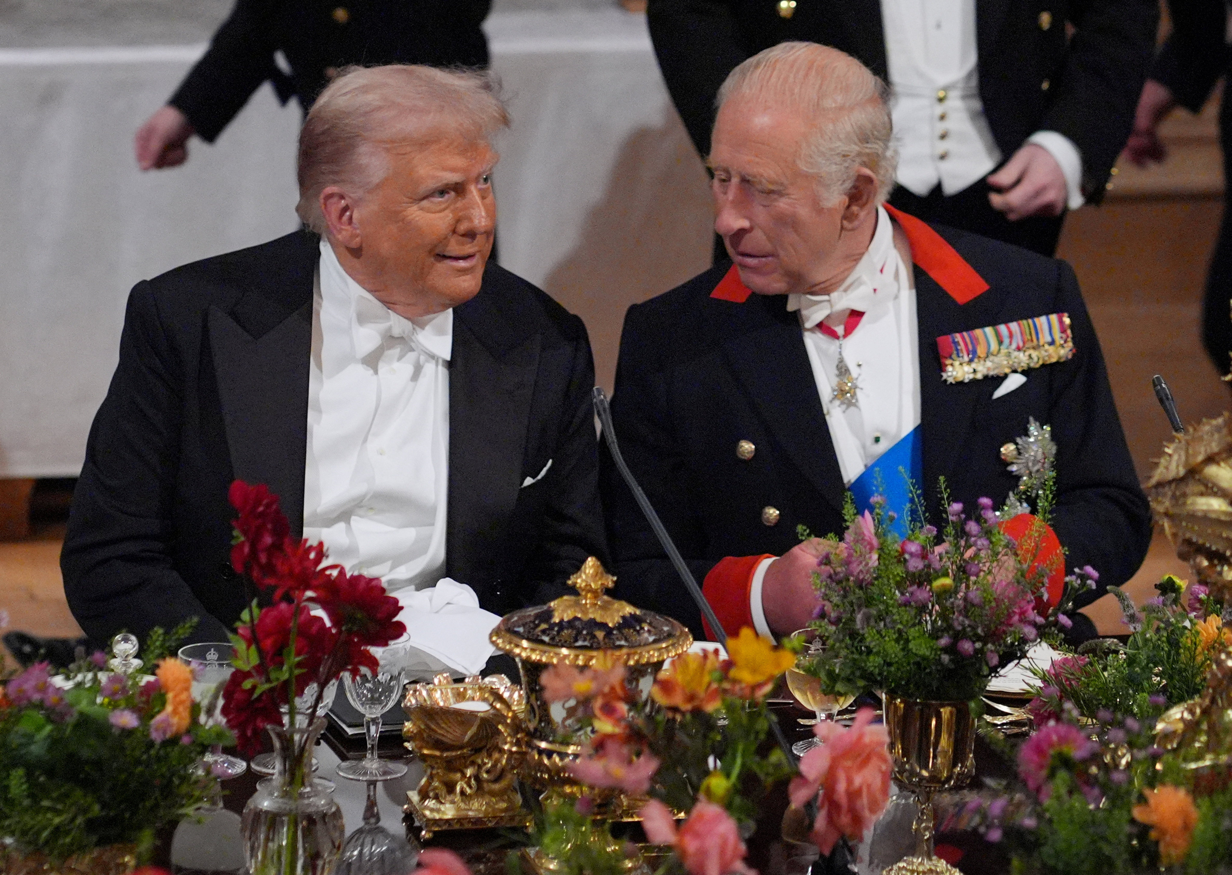 US President Donald Trump (left) and Brittain King Charles interact at the state banquet at Windsor Castle, Berkshire on Wednesday. Photo: Reuters