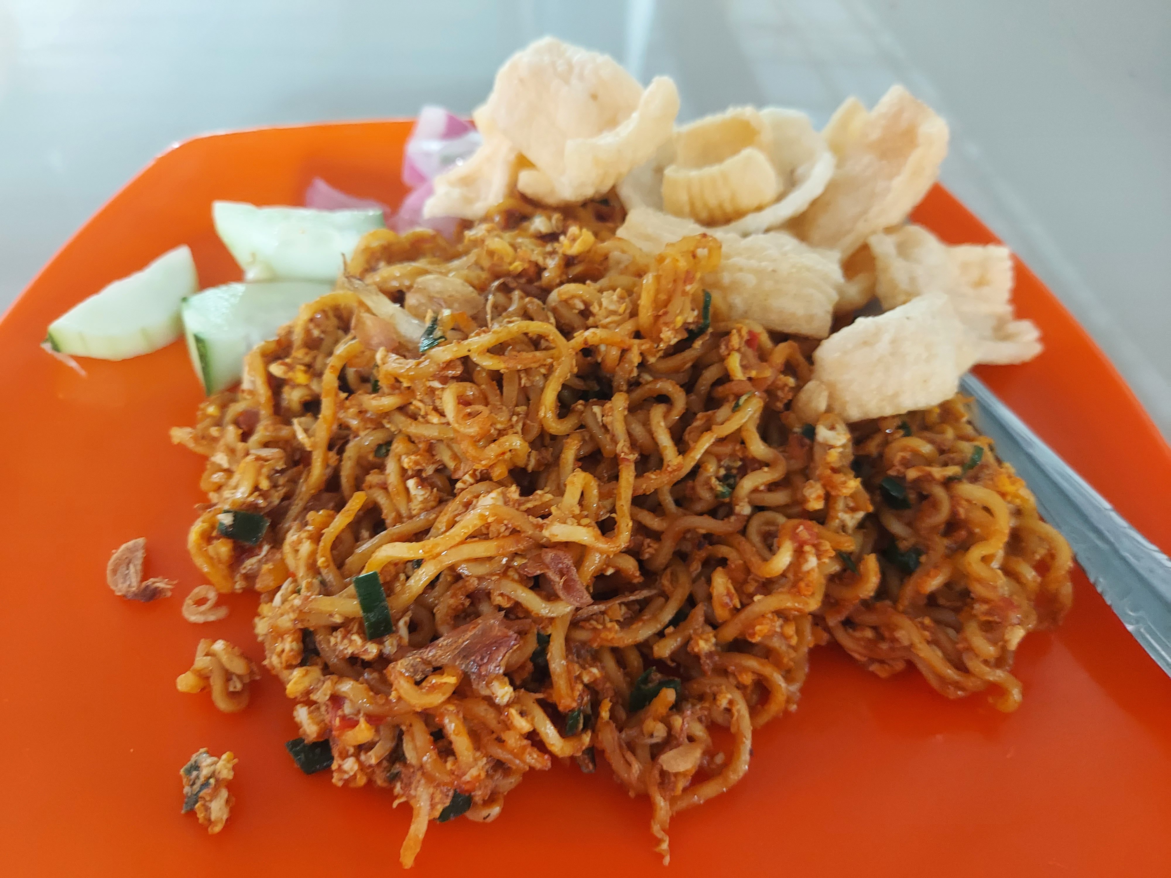 A plate of fried Indomie tossed with scrambled eggs served at the Ayah Husein cafe in Medan, Indonesia. Photo: Aisyah Llewellyn