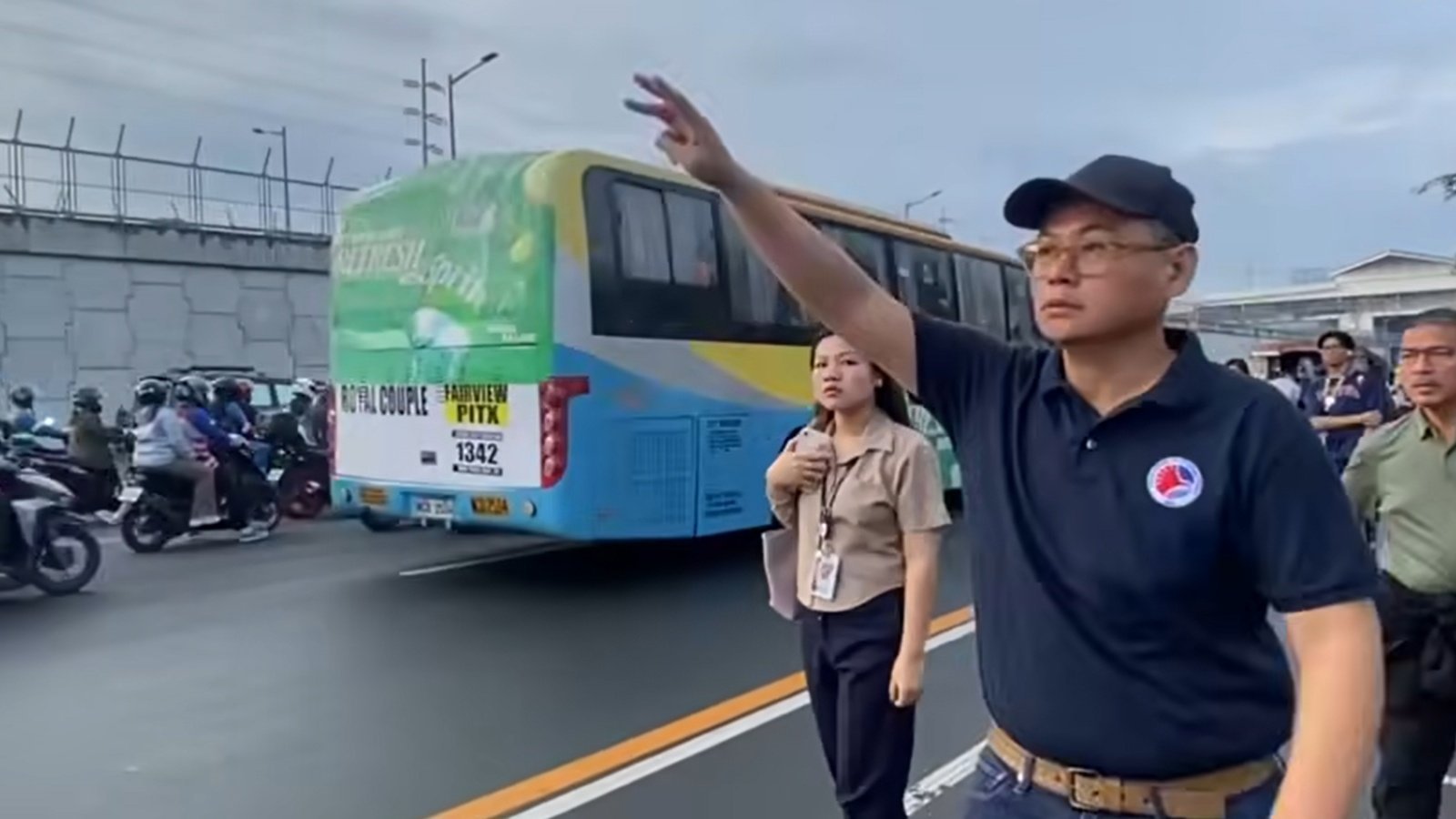 Acting Philippine Transport Secretary Giovanni Lopez attempting to catch a bus in Manila on Monday. Photo: Facebook/Department of Transportation - Philippines