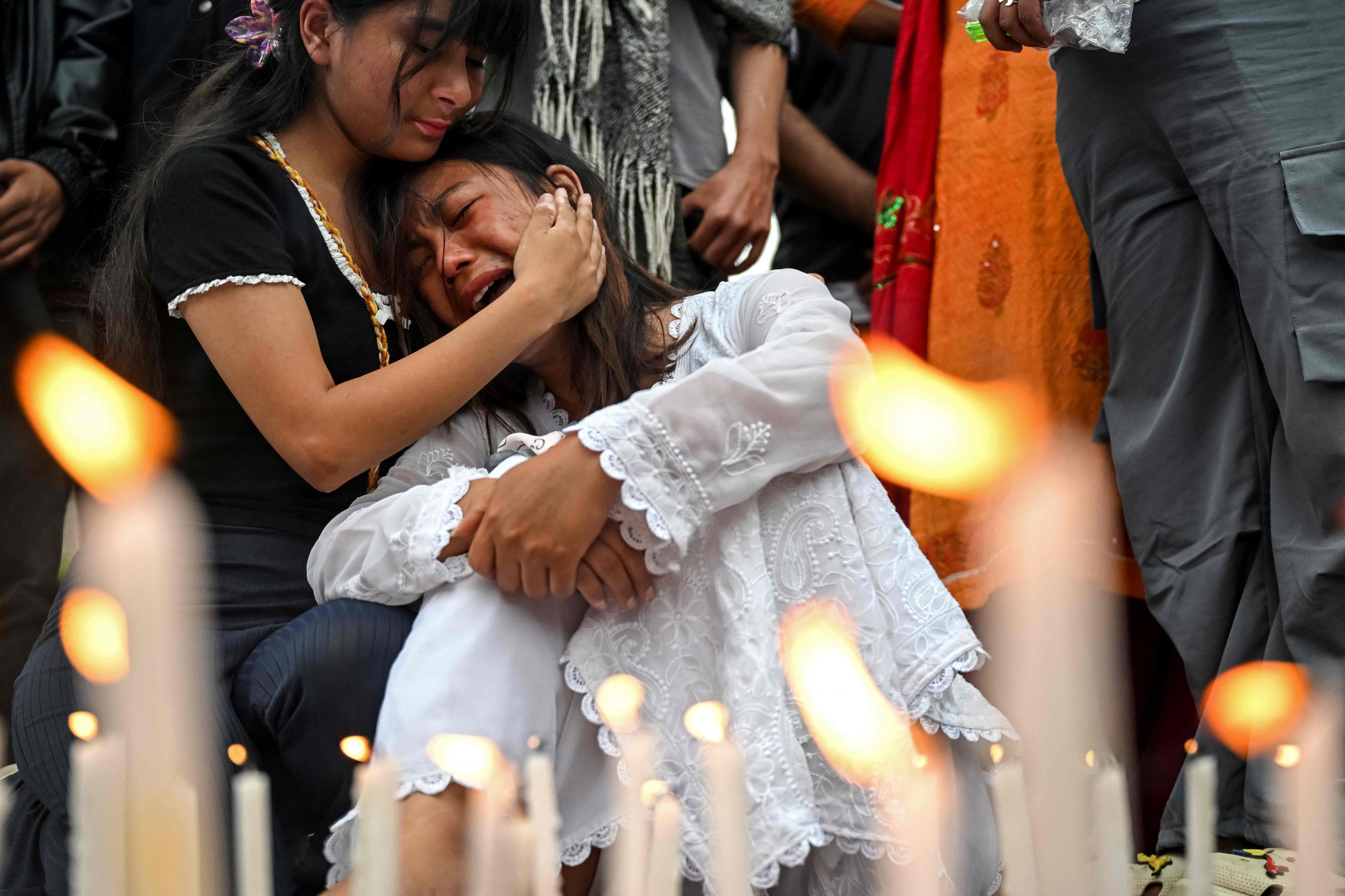 A family member of a victim reacts during a silent tribute in Kathmandu on Wednesday held in honour of those killed in Nepal’s protests. Photo: AFP
