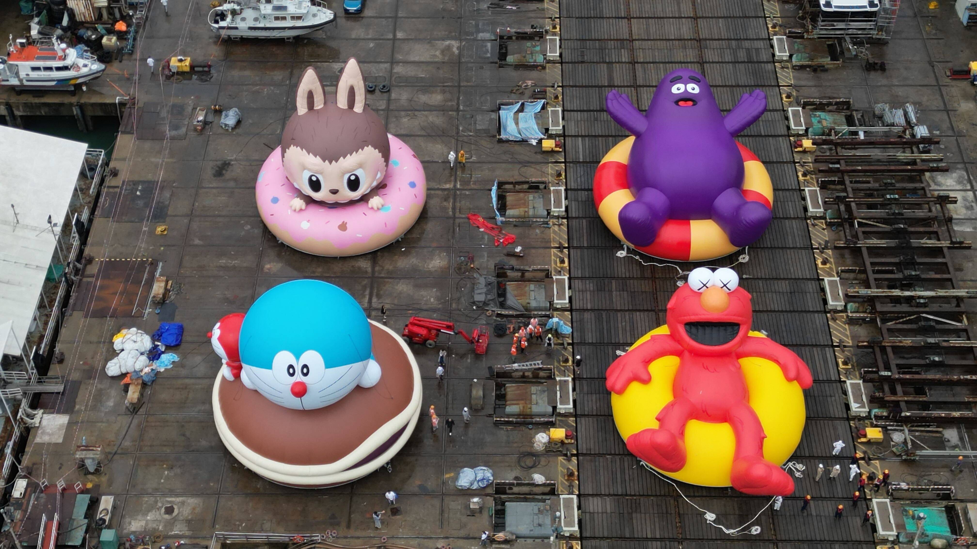 Inflatable characters of Labubu, Doraemon, Grimace and Elmo are set up ahead of the “Water Parade By AllRightsReserved at Victoria Harbour” event. Photo: Elson Li
