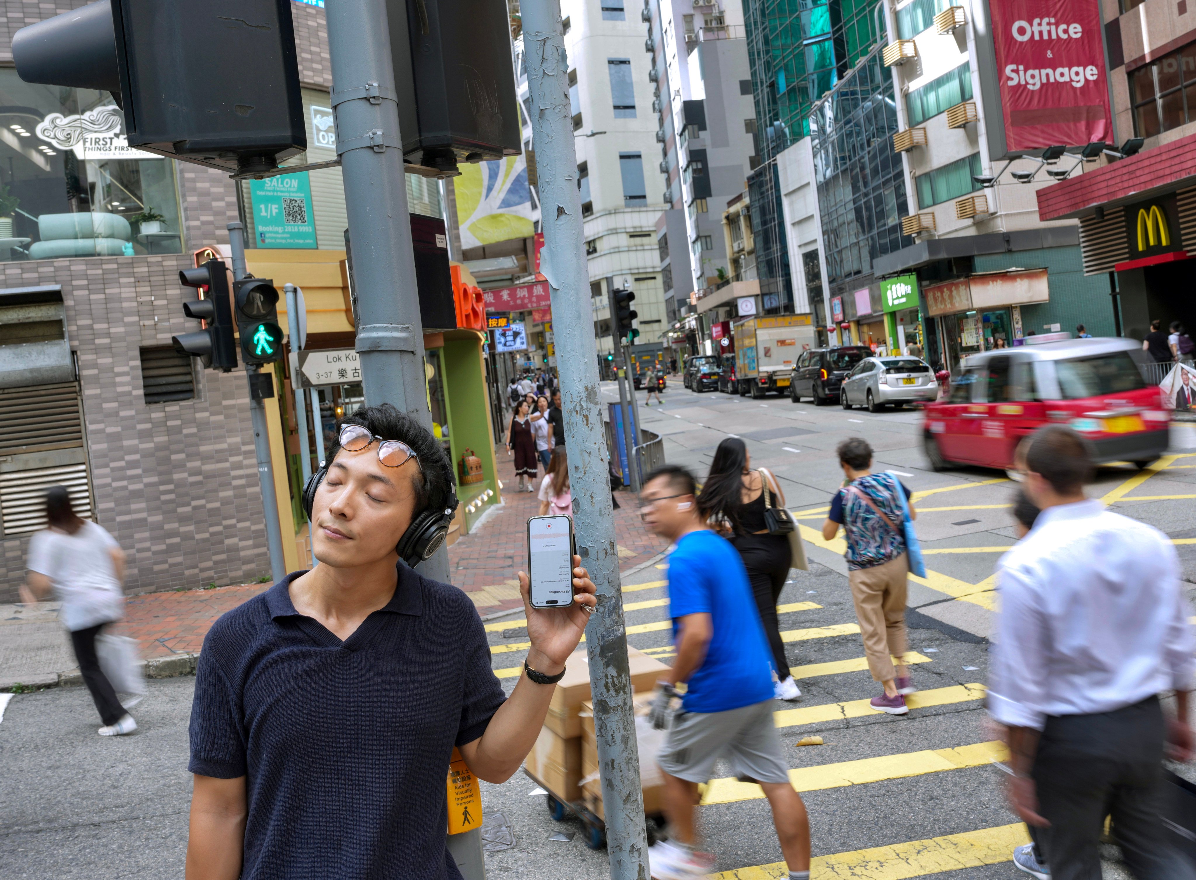 Laurie Lau, who records urban noises and remixes them into harmonies, poses for a picture in Sheung Wan. Photo: Karma Lo