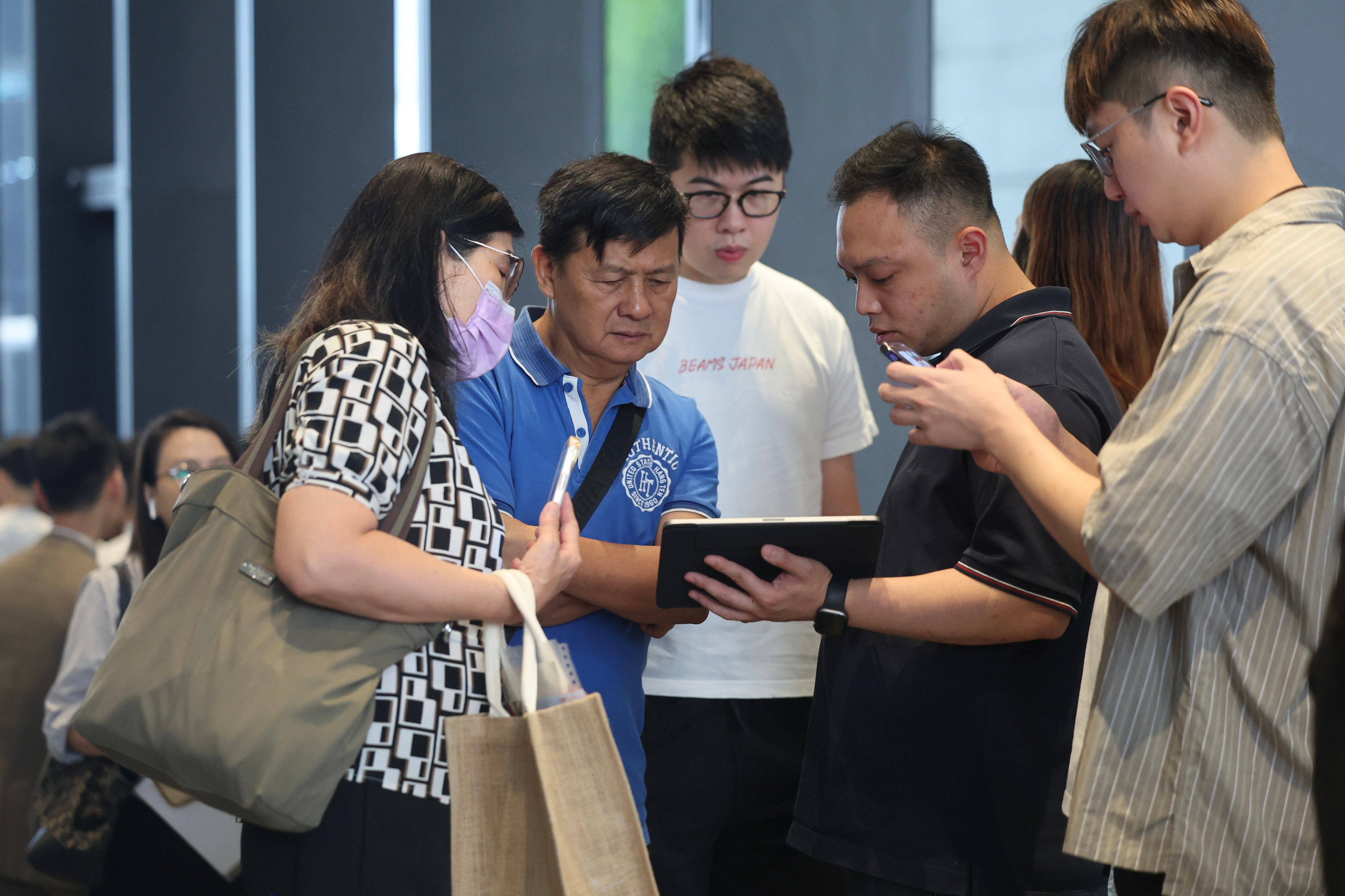 Potential buyers at the sales offices of Deep Water Pavilia in June. Photo: Edmond So