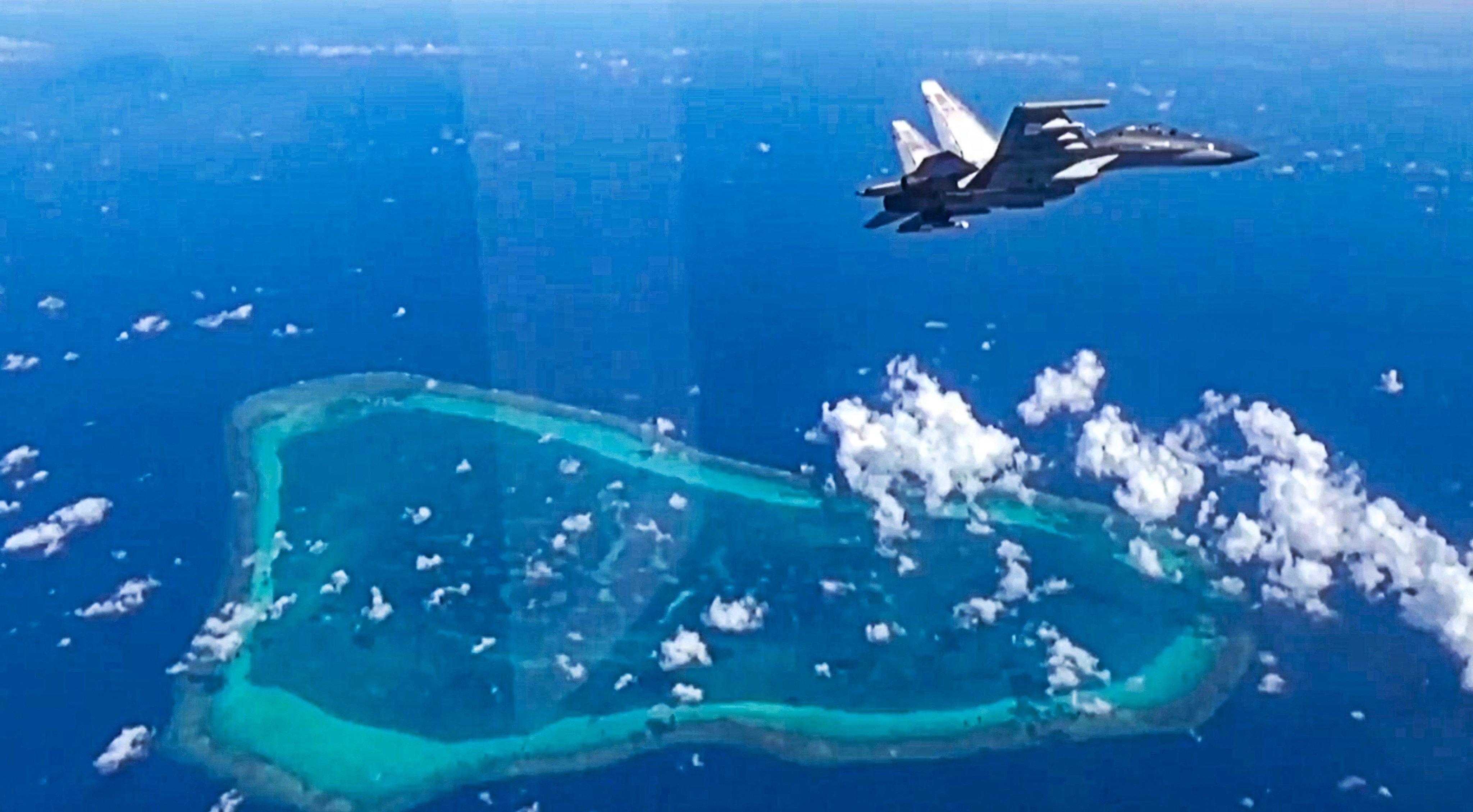 The Chinese military carries out combat readiness patrols in the waters and airspace around the disputed Scarborough Shoal in January. Photo: Weibo/ 玉淵譚天