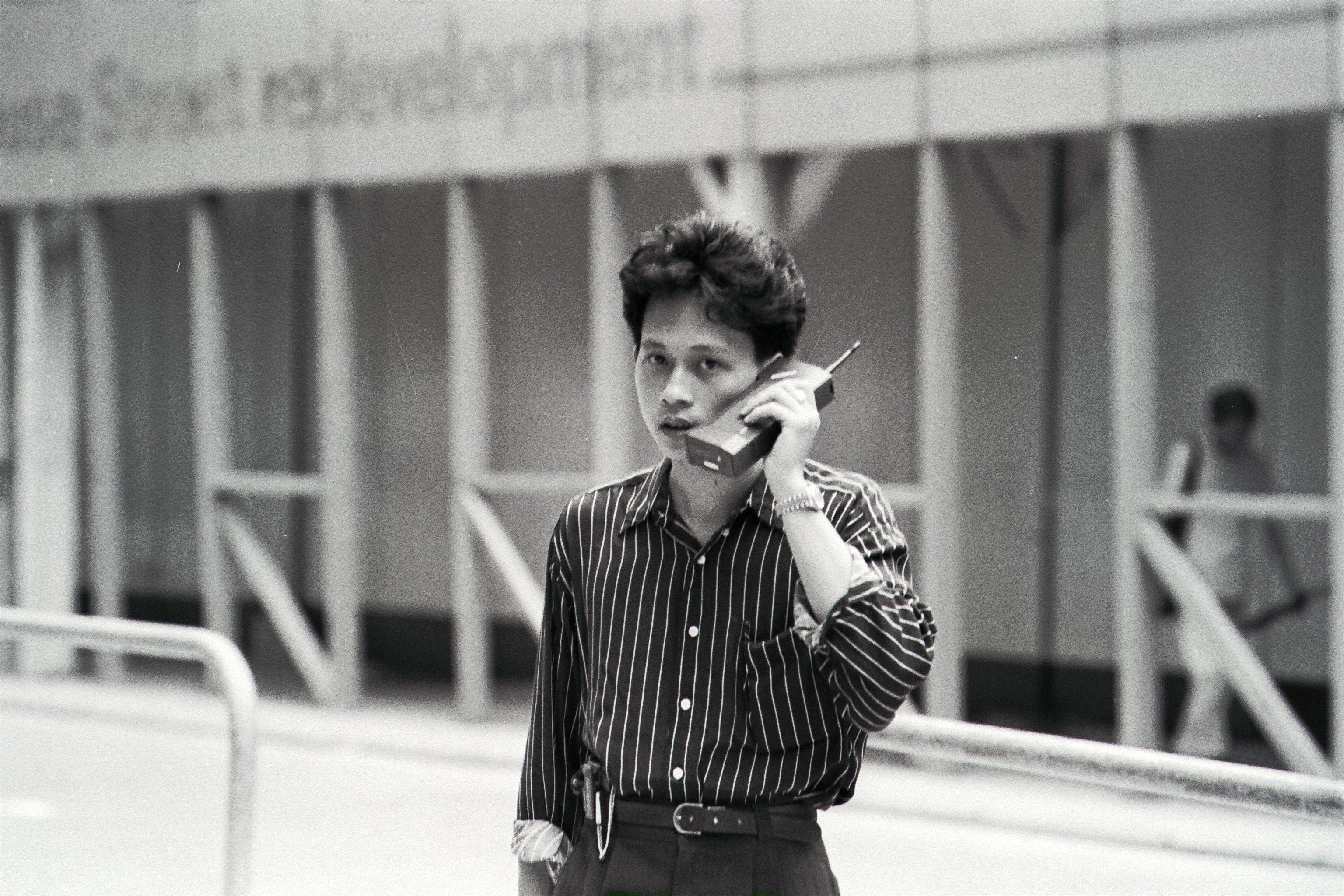 A man talking on a mobile phone in 1989. At the time, only the wealthy could afford hand-held devices. Photo: SCMP Archives