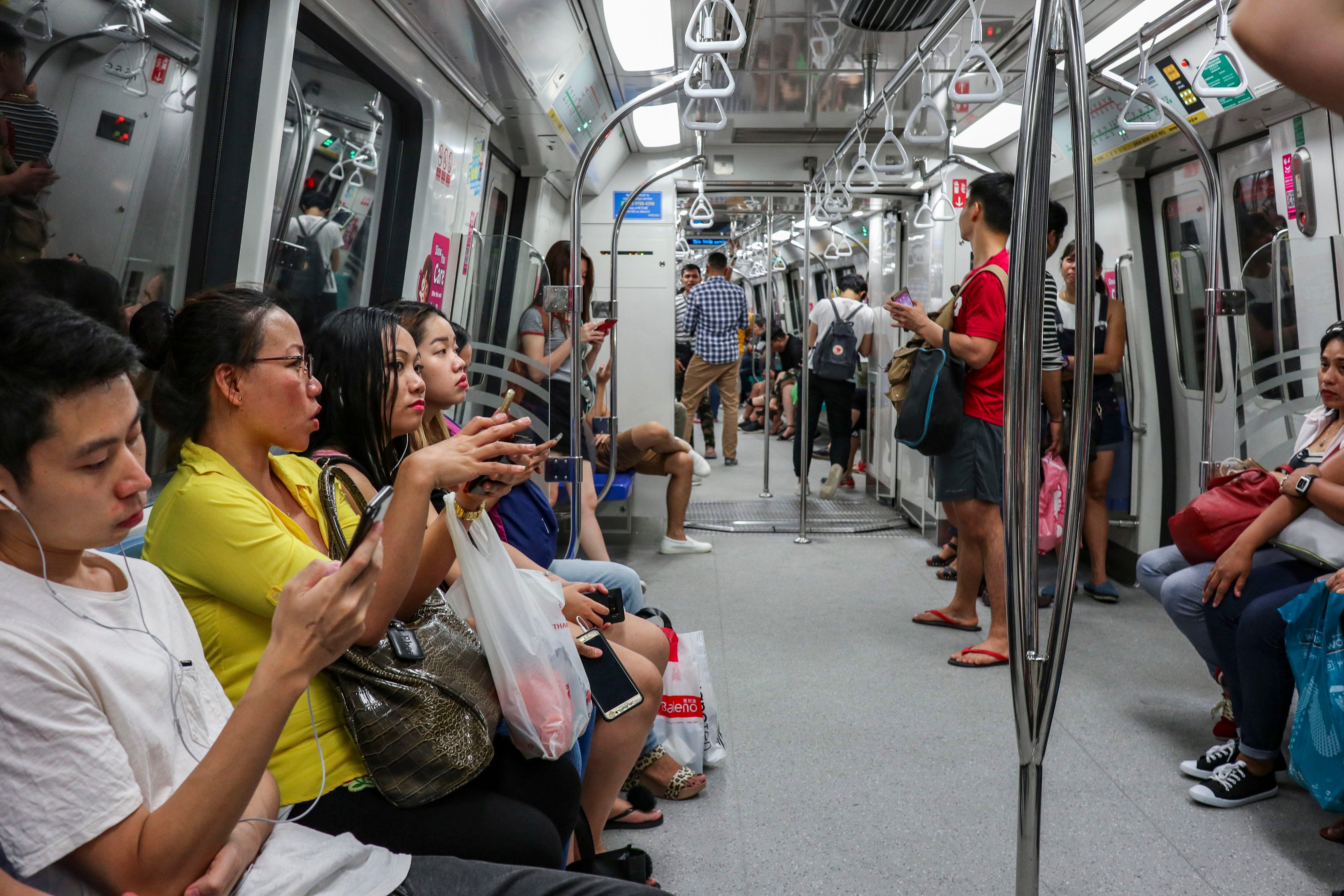 Commuters on an MRT train in Singapore. A string of service faults across several MRT and LRT lines in recent months disrupted travel in the city state. Photo: Roy Issa