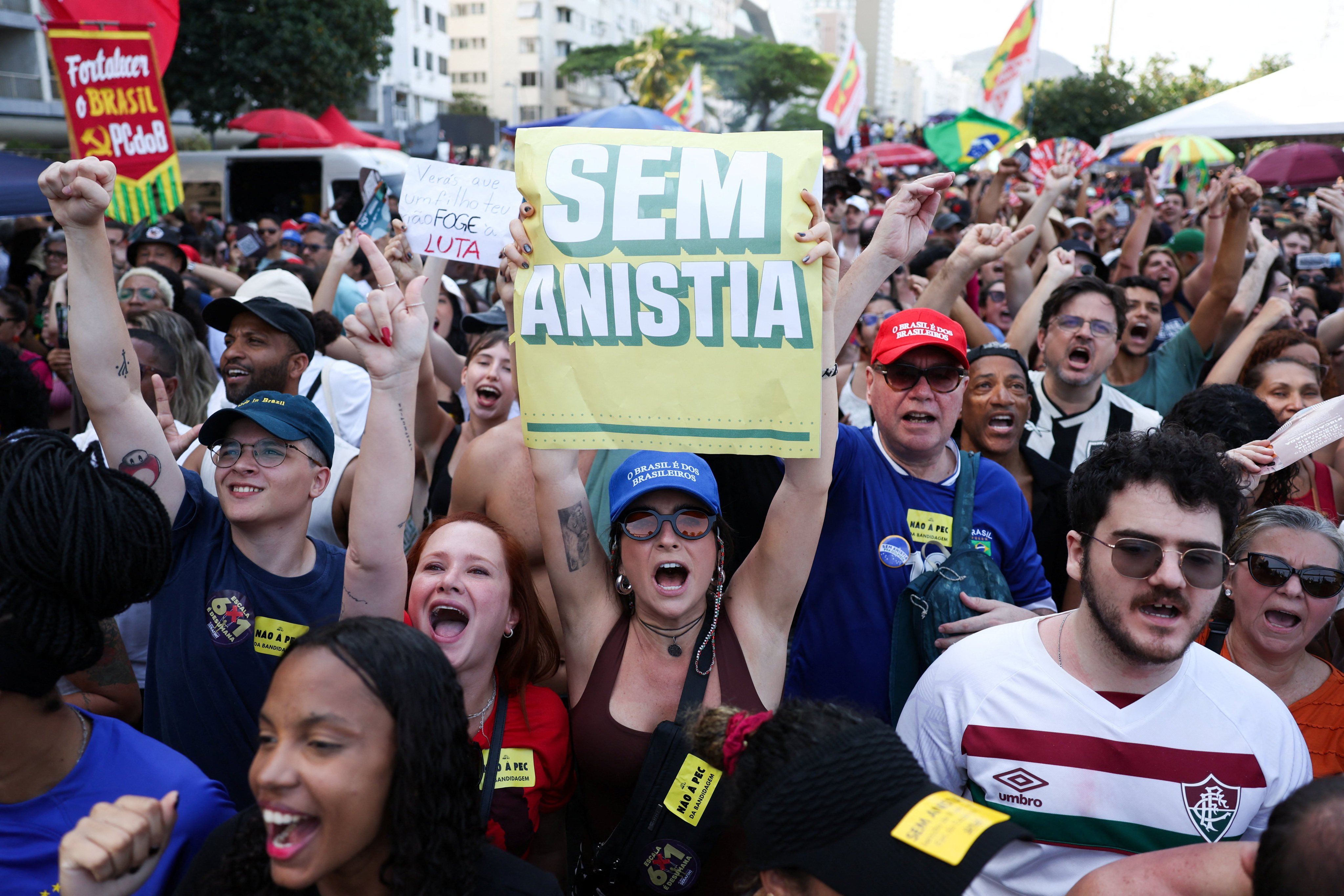 Brazilians protest against a proposed Amnesty Bill that would change penalties for those convicted of plotting a coup, set for a vote next week, at Copacabana beach in Rio de Janeiro on Sunday. Photo: Reuters