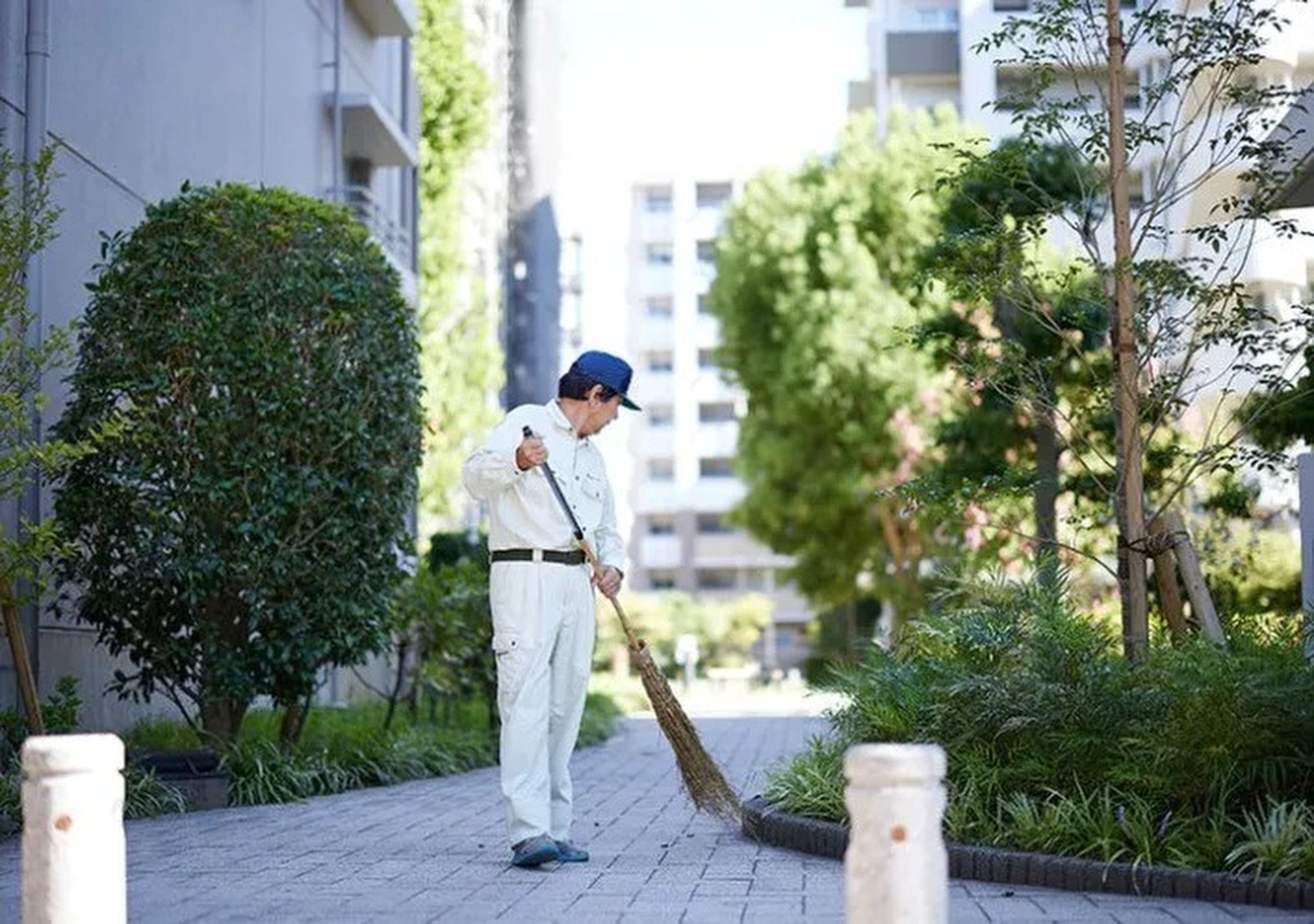 Koichi Matsubara cleans public areas and carries out basic maintenance at a block of flats in Tokyo. Photo: Handout