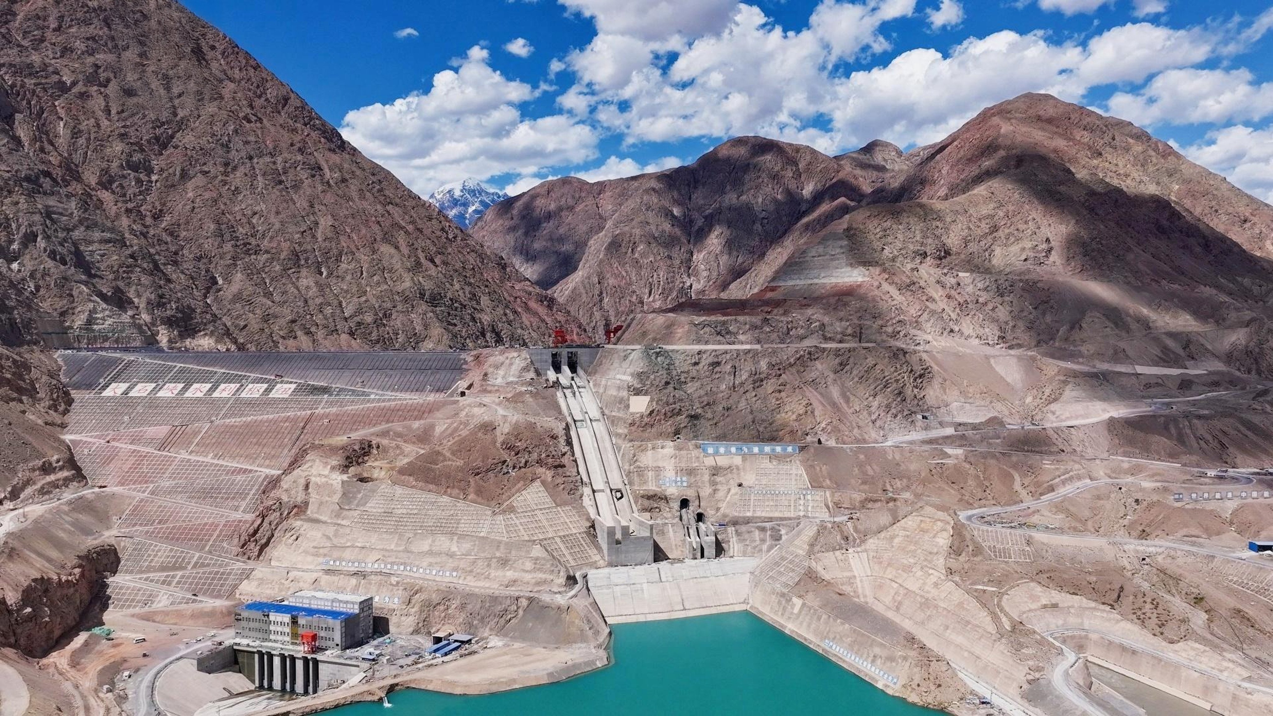 The Dashixia mega dam in Xinjiang is 247 metres high – about the same as an 80-storey building. Photo: CCTV
