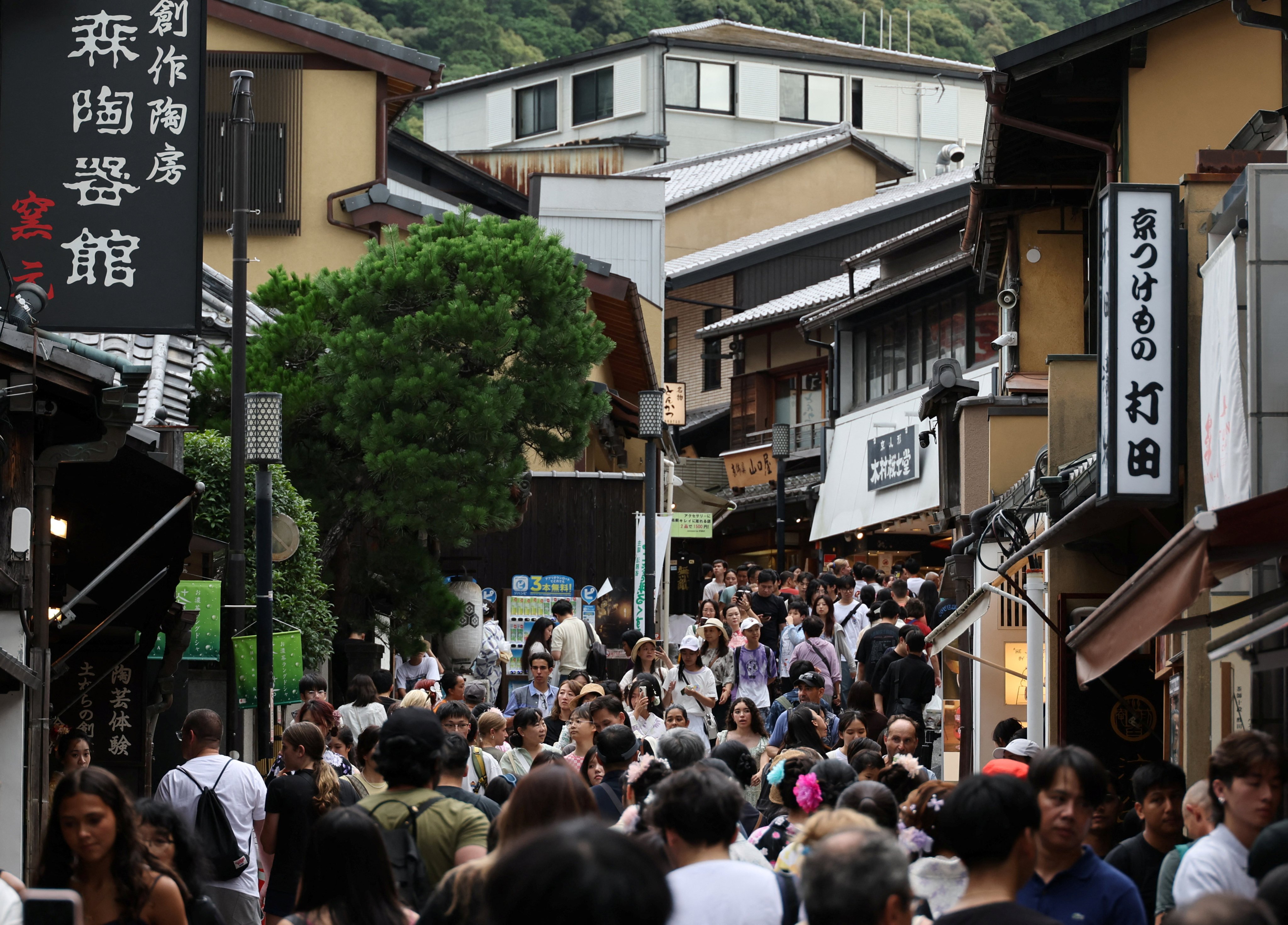 Visitors crowd a street leading to Kiyomizu Temple in Kyoto, Japan. A 2024 study by the Kyoto city government found that 56.06 million people visited over the course of the year. Photo: Reuters