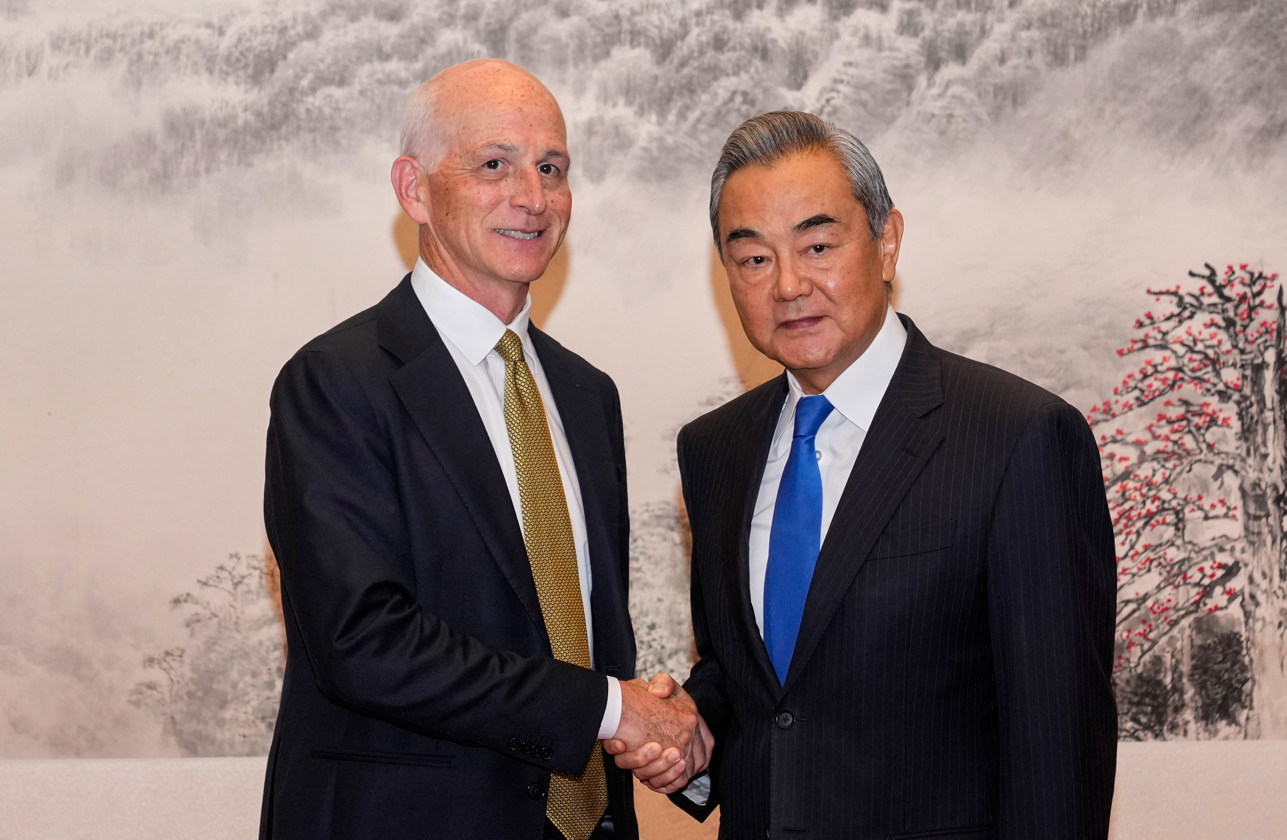 US Representative Adam Smith (left) shakes hands with Chinese Foreign Minister Wang Yi as he leads a bipartisan group of US lawmakers for a meeting at the Great Hall of the People in Beijing on Tuesday. Wang called on Washington to treasure the current “stabilising trend” in bilateral relations while upholding its “political commitments” regarding Taiwan. Photo: EPA/POOL
