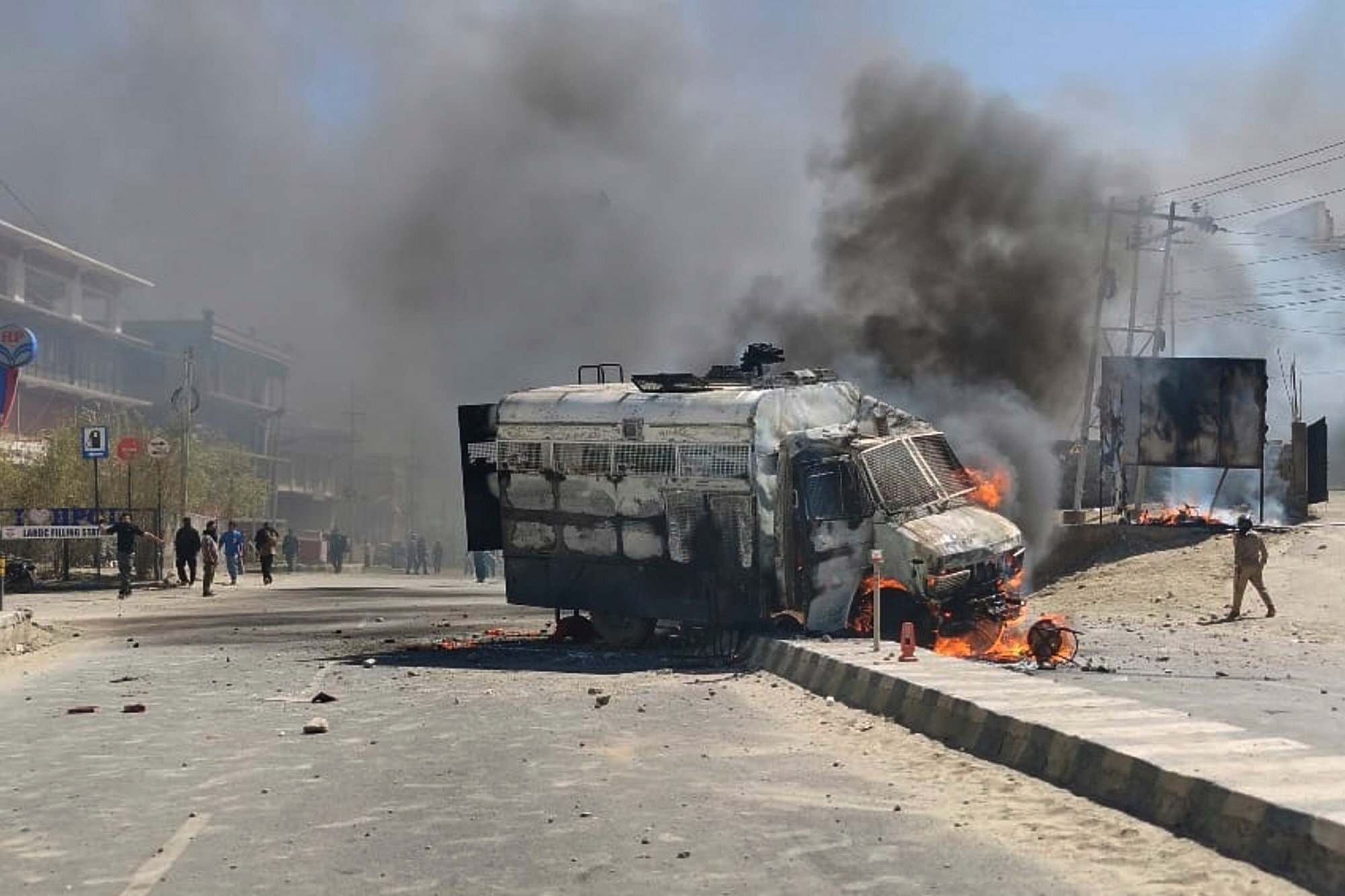 A police vehicle is set on fire during a protest by locals demanding federal statehood from the Indian government in the region of Ladakh on Wednesday. Photo: AP